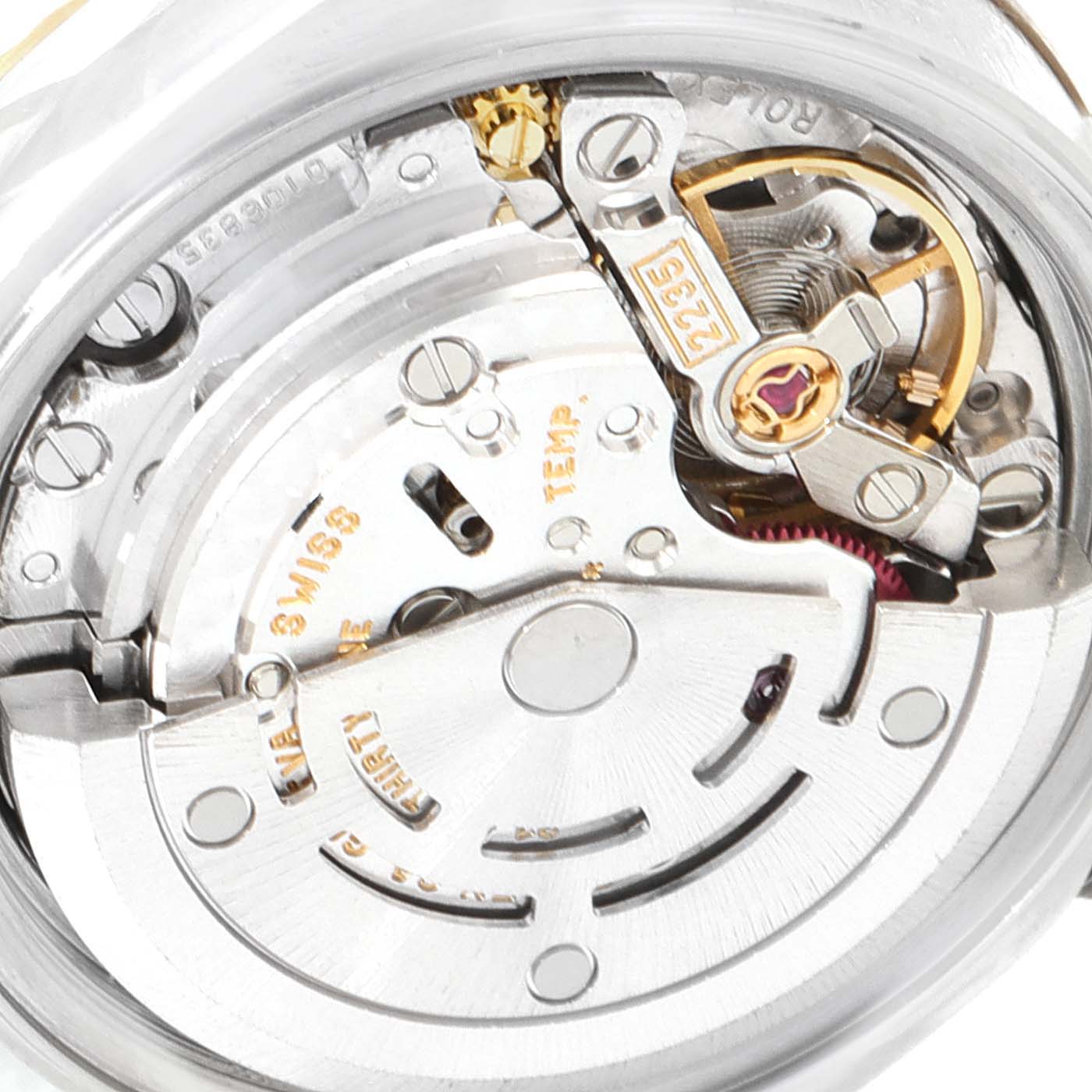 This image shows a close-up of the Datejust by Rolex, focusing on its internal movement and intricate components.