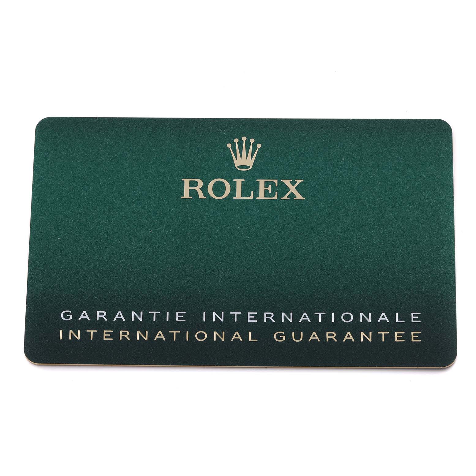 The image shows a Rolex international guarantee card for the Mid-Size model, viewed from the top.