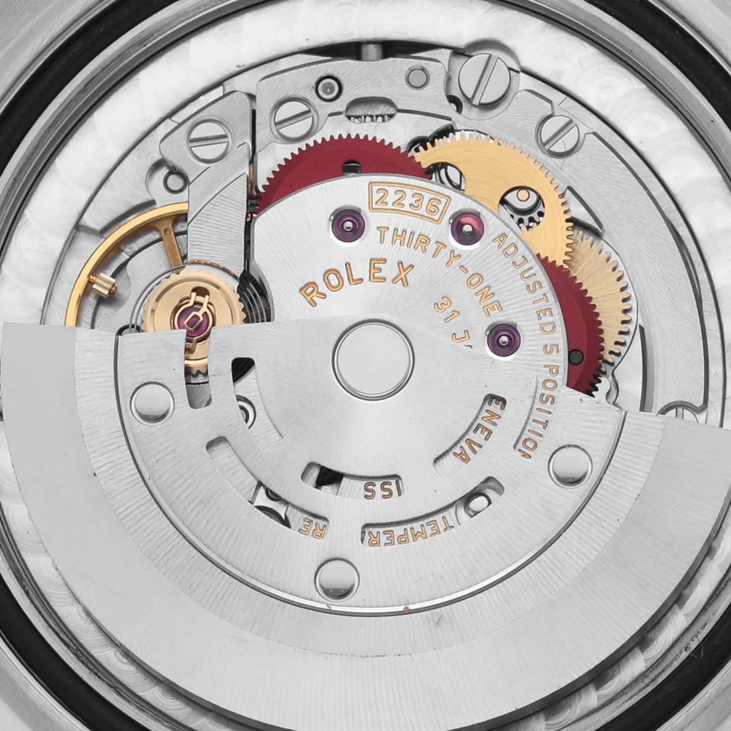 The image shows the intricate movement of a Rolex Mid-Size 278273 Women's Steel and Gold (two tone) Green Dial 278273 Women's Steel and Gold (two tone) Green Dial model, highlighting gears and the rotor from a top view.