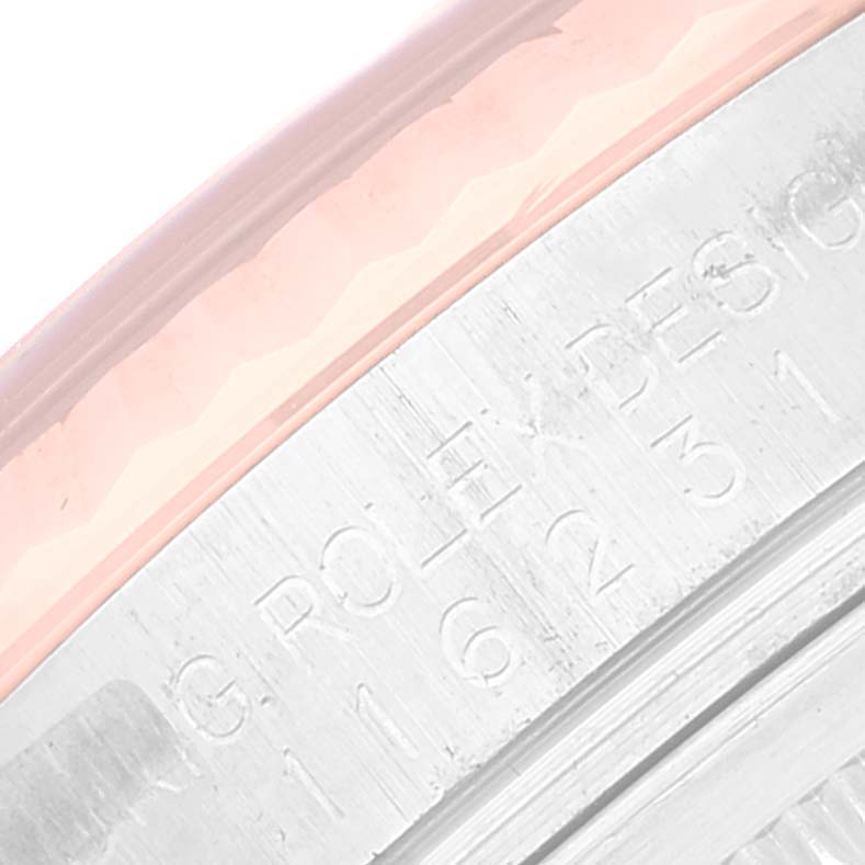 This image shows a close-up of the engraved inner bezel of a Rolex Datejust 116231 Men's Steel and Gold (two tone) Black Dial 116231 Men's Steel and Gold (two tone) Black Dial watch.