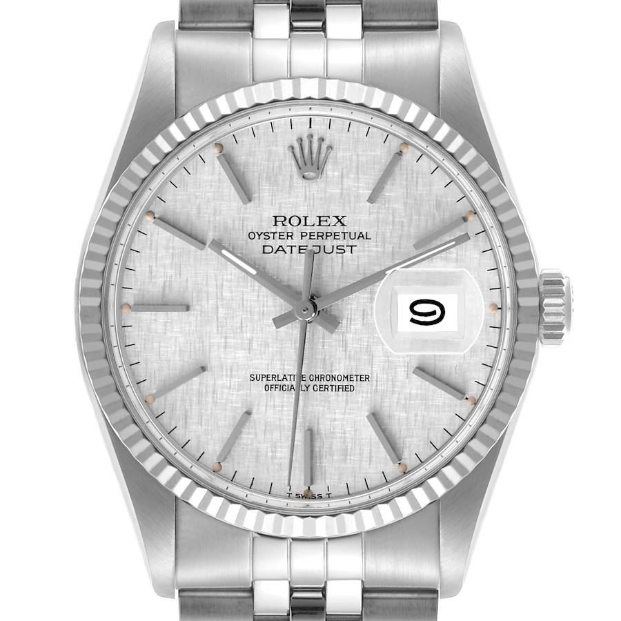 The image shows a front view of a Rolex Datejust, highlighting the dial, hands, date window, and fluted bezel.