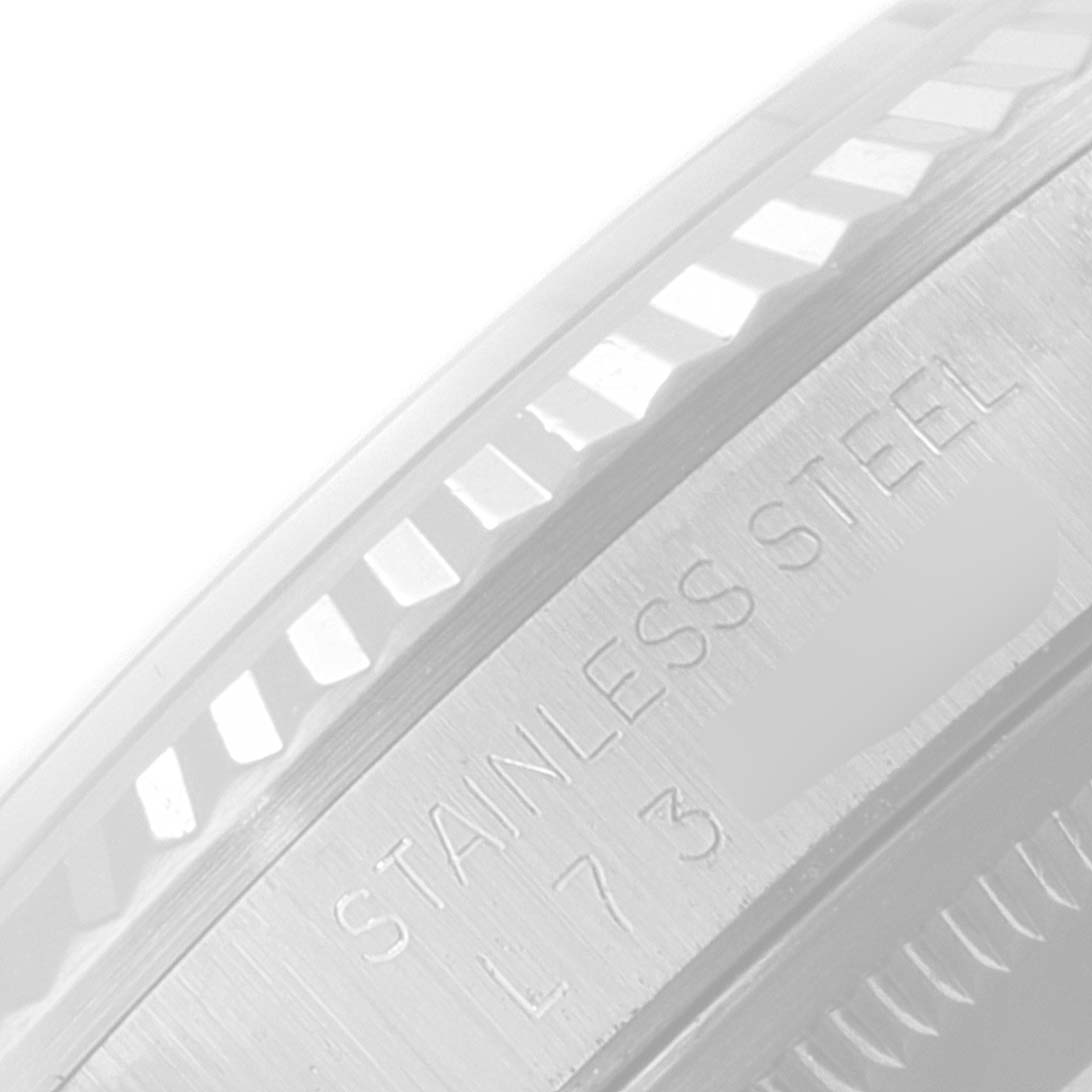 The image shows a close-up of the stainless steel bezel and part of the side case of a Rolex Datejust 16234 Men's Stainless Steel Silver Dial 16234 Men's Stainless Steel Silver Dial.