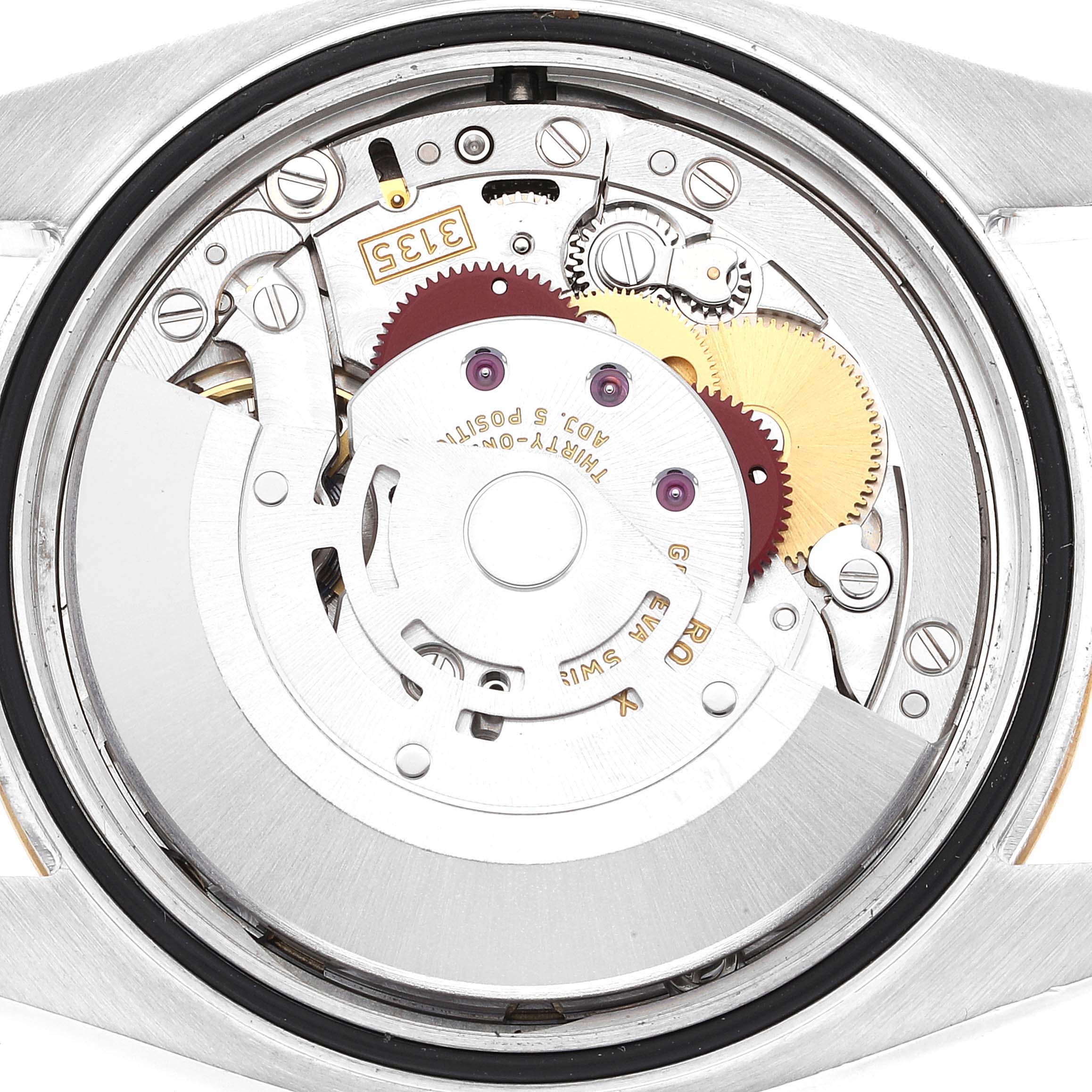 This image shows the internal mechanism of a Rolex Datejust 116233 Men's Steel and Gold (two tone) Champagne Dial 116233 Men's Steel and Gold (two tone) Champagne Dial watch, highlighting its gears and movement parts.