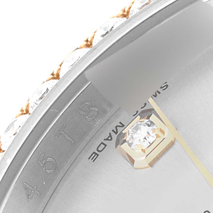Close-up of the bezel and part of the dial with a diamond marker of a Rolex Datejust 116243 Men's Steel and Gold (two tone) Silver Dial 116243 Men's Steel and Gold (two tone) Silver Dial watch.