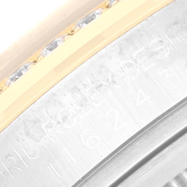 This image shows a close-up of the bezel and case of a Rolex Datejust 116243 Men's Steel and Gold (two tone) Silver Dial 116243 Men's Steel and Gold (two tone) Silver Dial watch, highlighting its gold and diamond accents.