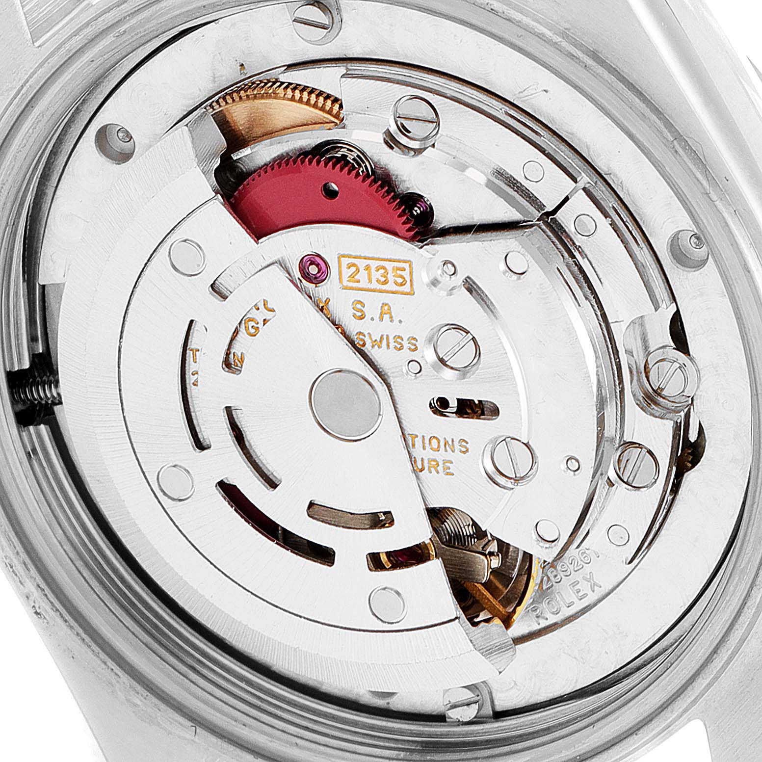 This image shows the intricate internal mechanism of a Rolex Mid-Size 68243 Women
s Steel and Gold (two tone) Black Dial 68243 Women
s Steel and Gold (two tone) Black Dial watch from the back view.