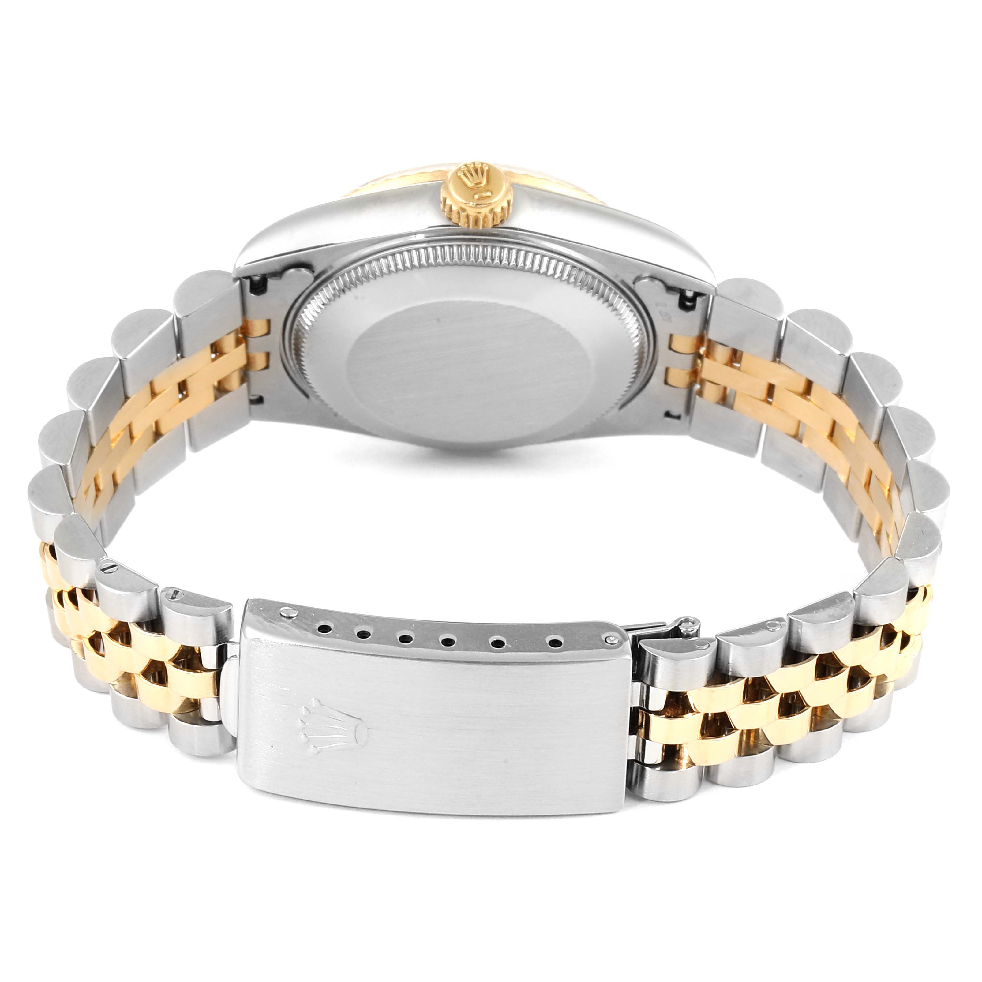 The image shows the back view of a Mid-Size Rolex watch, highlighting its case back, bracelet, and clasp.