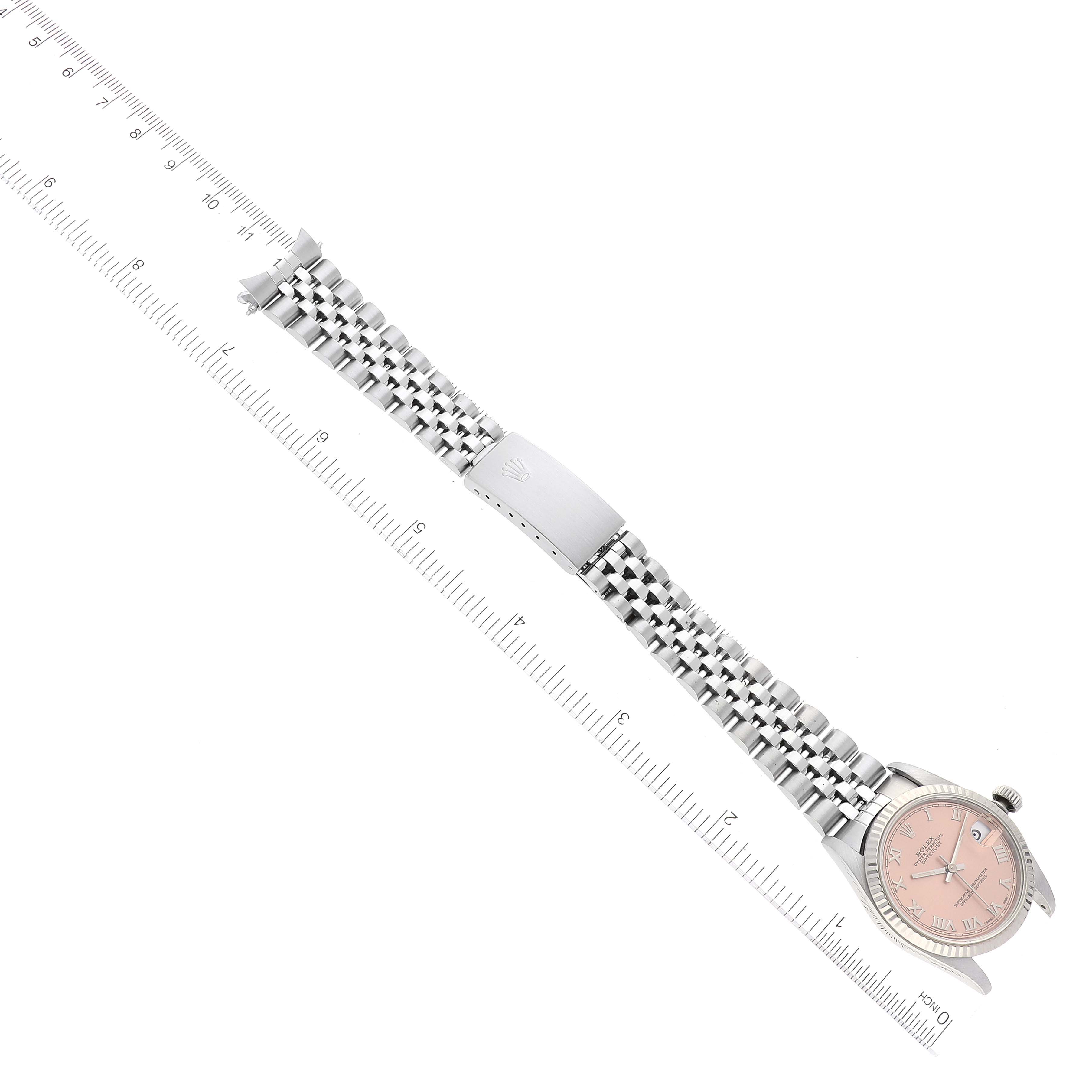 The image shows a top-down angle of a Rolex Mid-Size 68274 Women
s Stainless Steel Pink Dial 68274 Women
s Stainless Steel Pink Dial watch displaying its full bracelet, clasp, and dial.