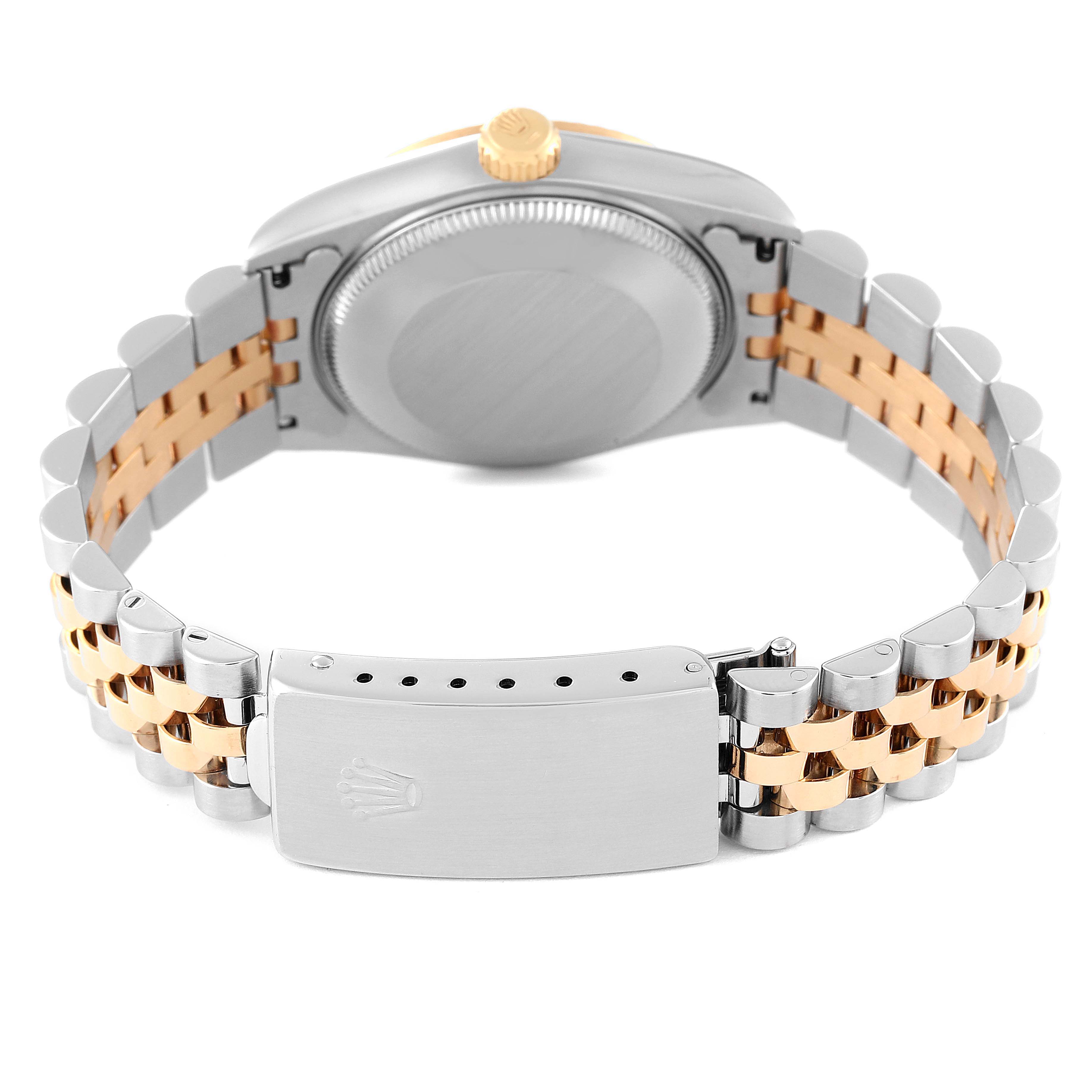 This is a rear view of a Rolex Mid-Size 68273 Women
s Steel and Gold (two tone) Champagne Dial 68273 Women
s Steel and Gold (two tone) Champagne Dial watch showing its back case, crown, and two-tone bracelet with clasp.