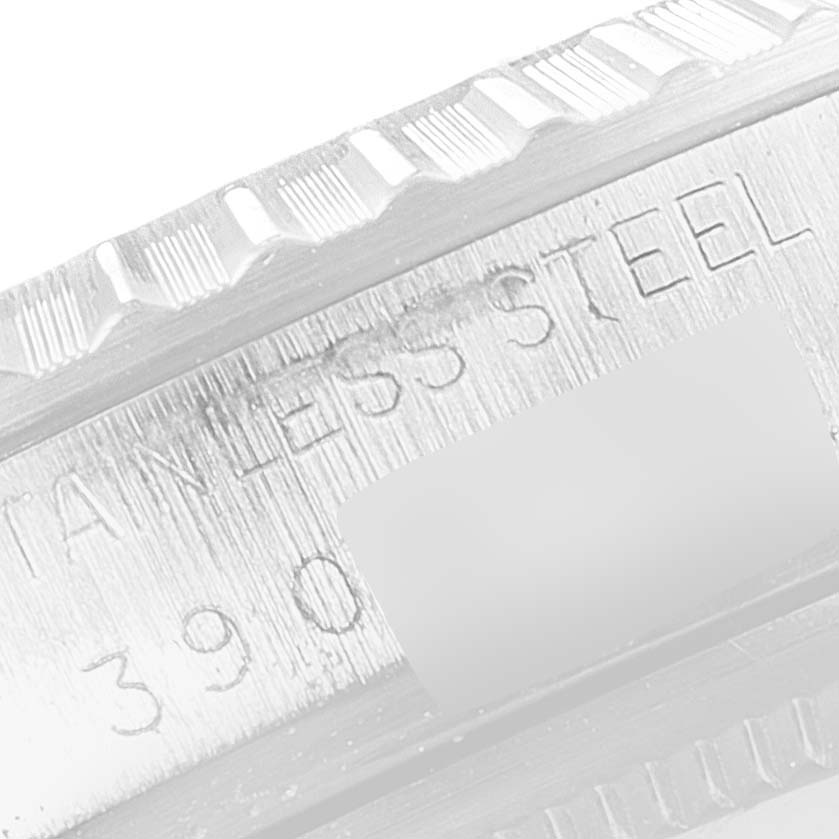 The image shows a close-up of the outer edge and engraved text on a Vintage Collection Rolex watch bezel.