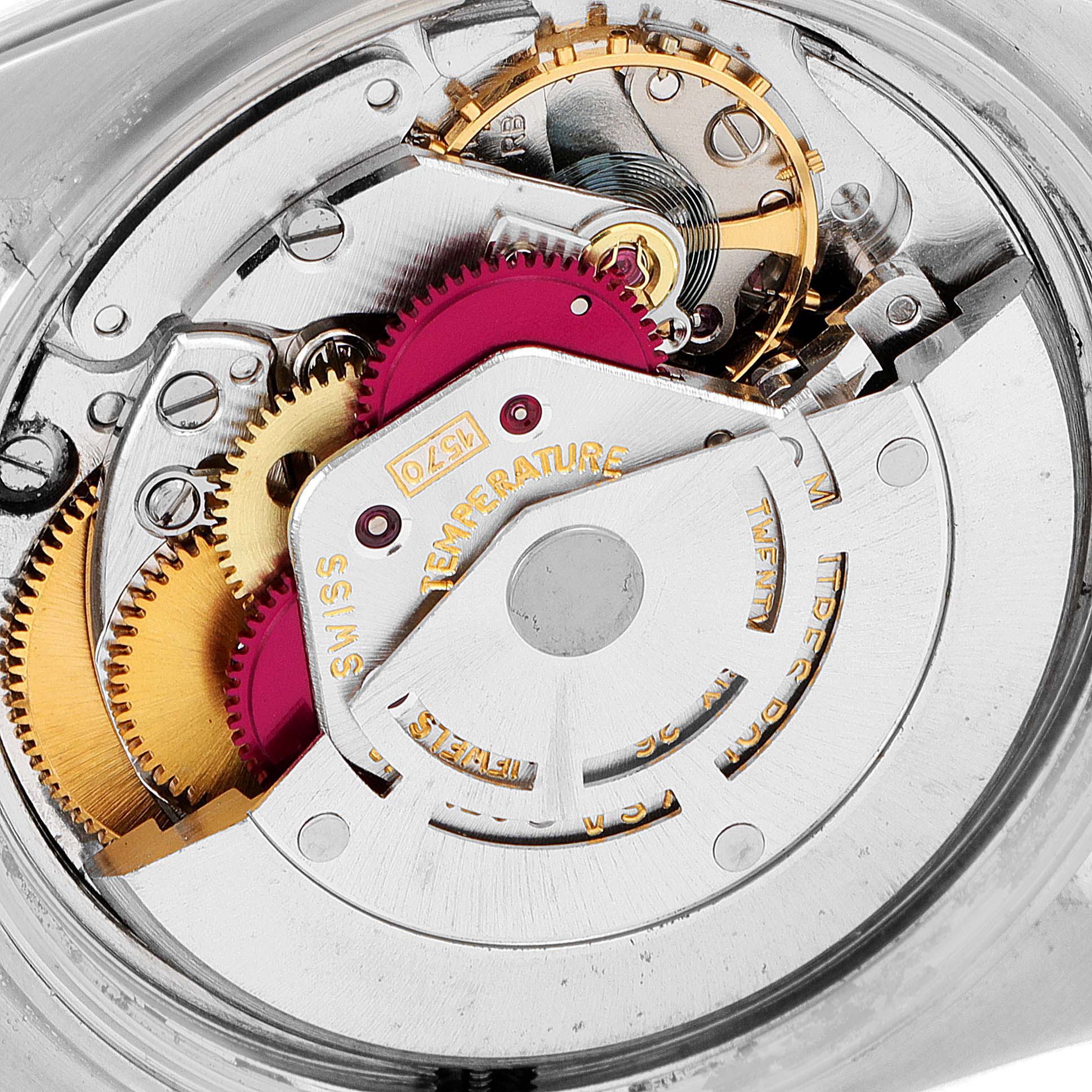 The image shows a close-up of the internal mechanical components and gears of a Vintage Collection model by Rolex.