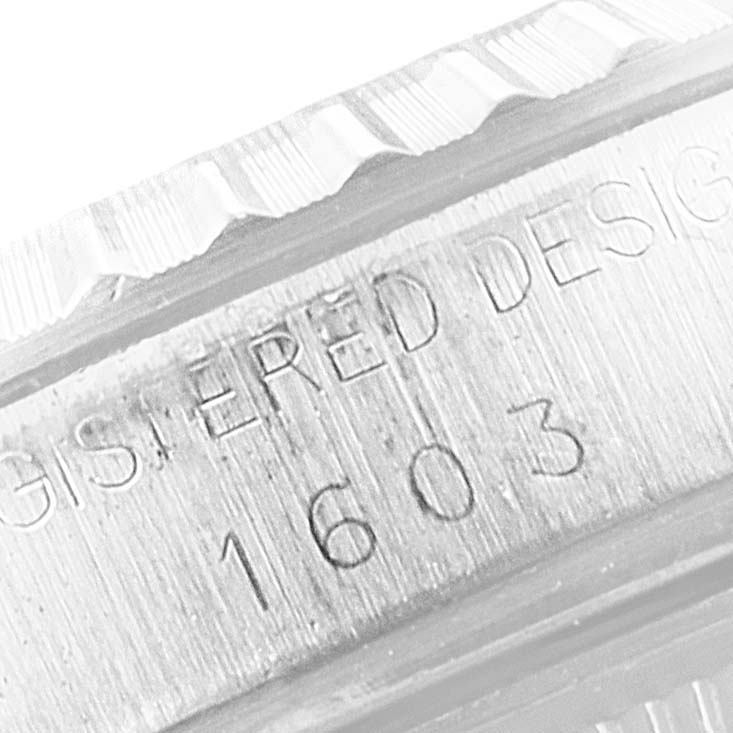 The image shows the engraved model number "1603" on the case side of a Rolex Vintage Collection 1603 Men's Stainless Steel Silver Dial 1603 Men's Stainless Steel Silver Dial watch.