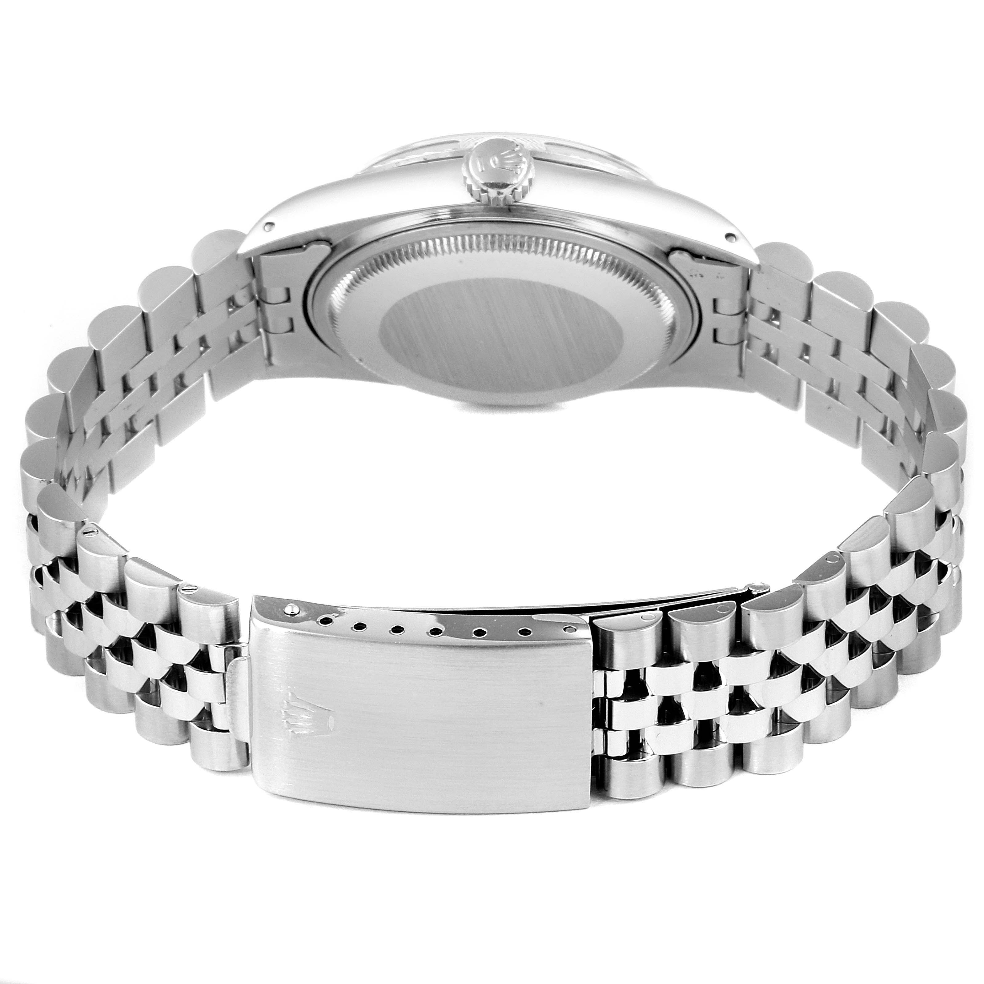 This image shows the back case and stainless steel bracelet of a Vintage Collection Rolex watch.