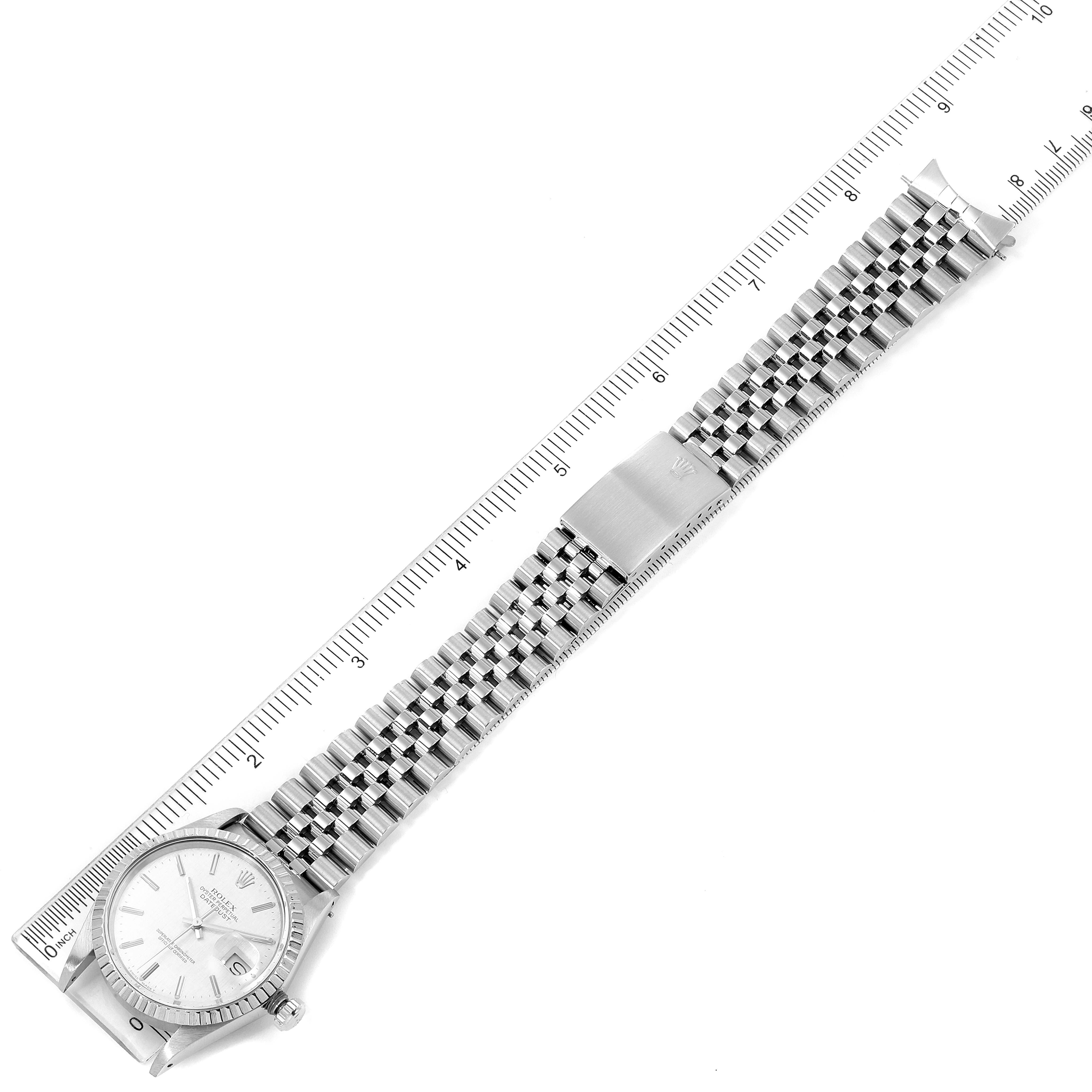 This image shows a full view of the Rolex Vintage Collection 16030 Men's Stainless Steel Silver Dial 16030 Men's Stainless Steel Silver Dial watch, including the face, bracelet, and clasp, placed next to a measuring ruler.