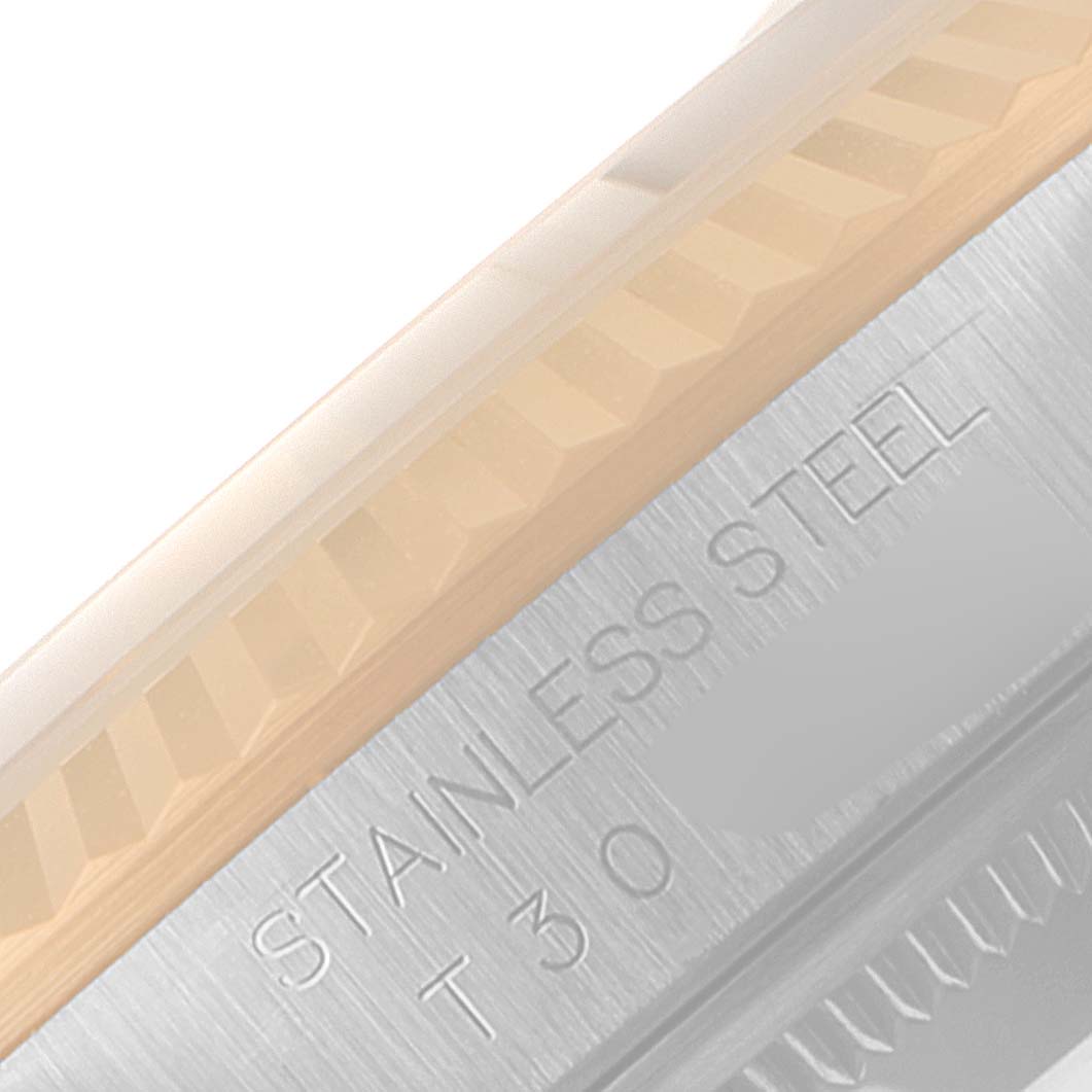 The image shows a close-up of the fluted bezel and the brushed stainless steel case of a Rolex Datejust 16233 Men
s Steel and Gold (two tone) Champagne Dial 16233 Men
s Steel and Gold (two tone) Champagne Dial watch.