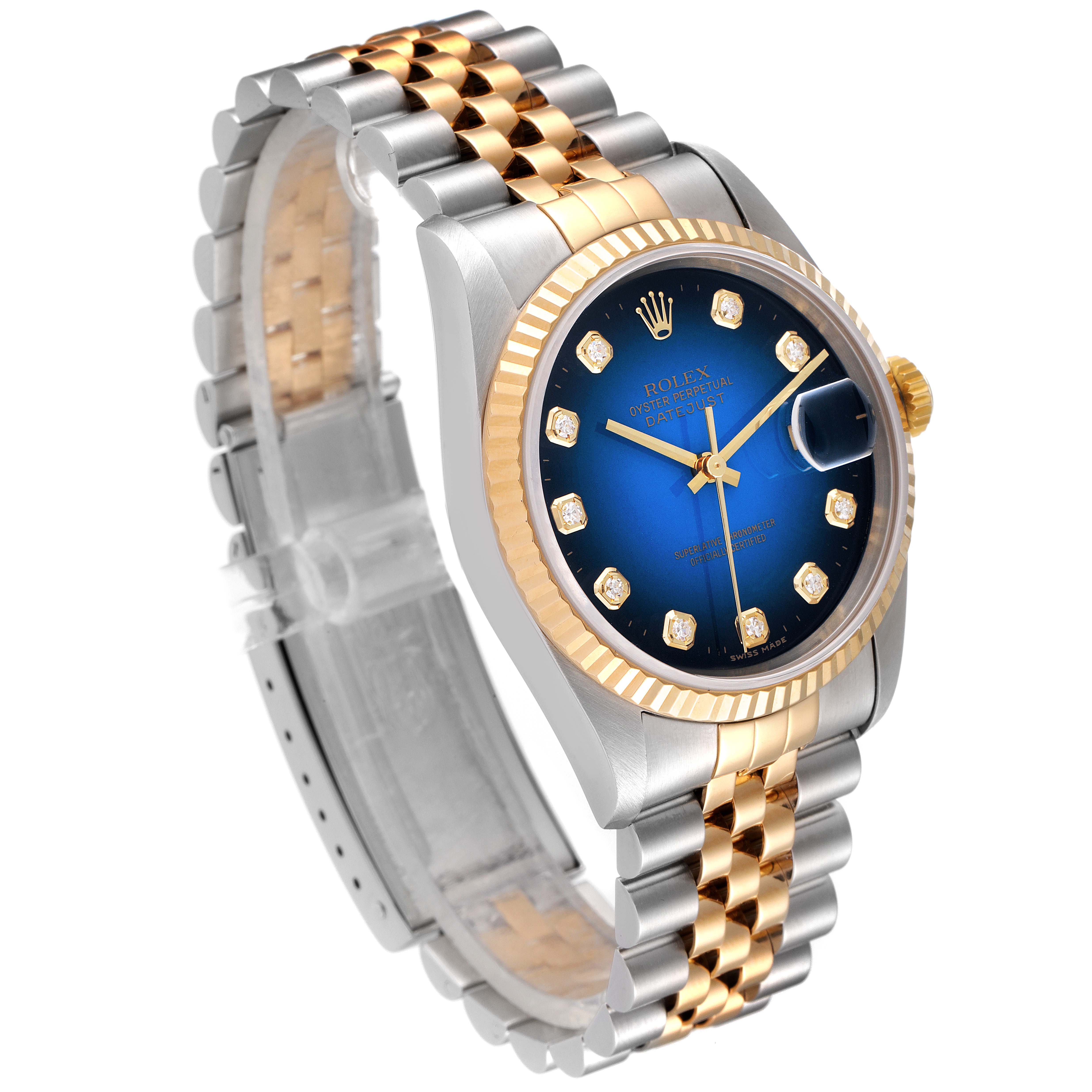 The image shows a Rolex Datejust 16233 Men's Steel and Gold (two tone) Blue Dial 16233 Men's Steel and Gold (two tone) Blue Dial watch at a three-quarter angle, highlighting its blue dial, fluted bezel, and two-tone bracelet.
