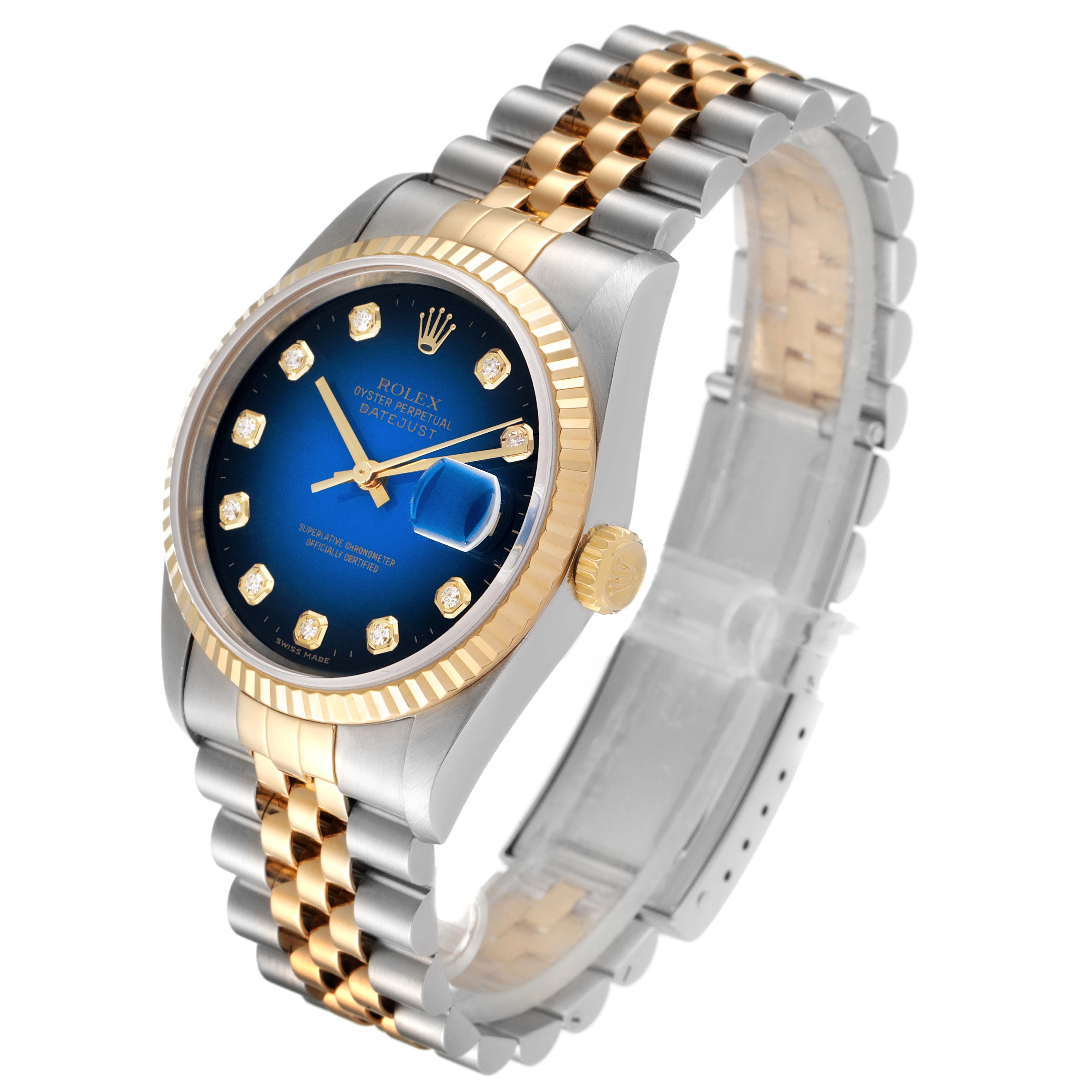 The image shows a Rolex Datejust 16233 Men's Steel and Gold (two tone) Blue Dial 16233 Men's Steel and Gold (two tone) Blue Dial watch from an angle highlighting its face, crown, and two-tone bracelet.