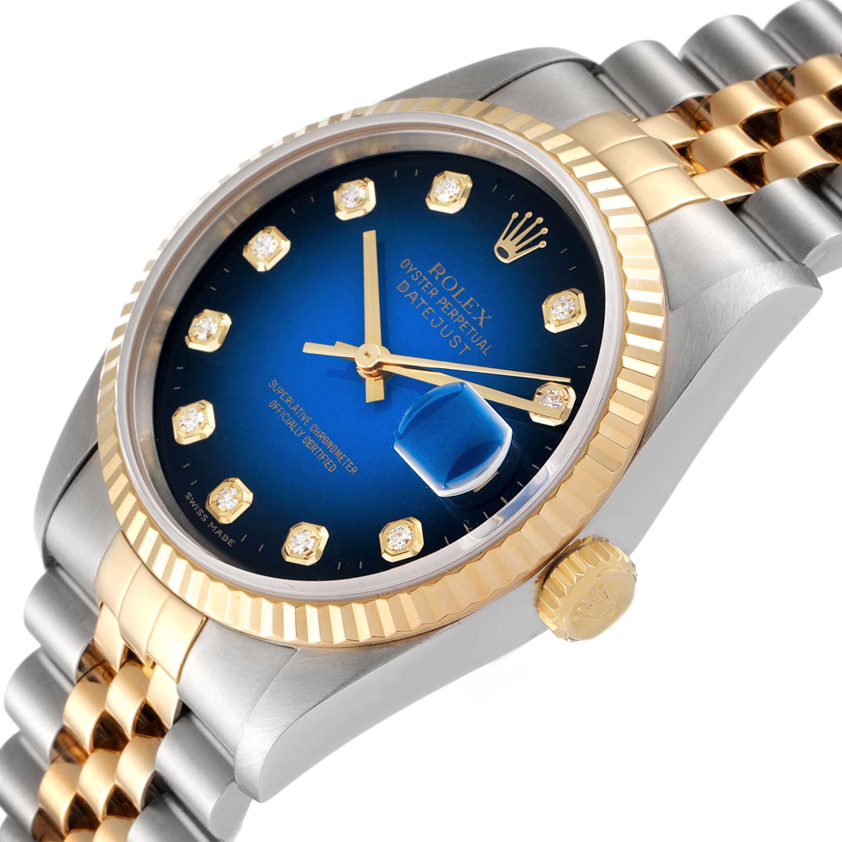 The image shows a Rolex Datejust 16233 Men's Steel and Gold (two tone) Blue Dial 16233 Men's Steel and Gold (two tone) Blue Dial watch at a tilted angle highlighting the blue dial, gold accents, date window, and fluted bezel.