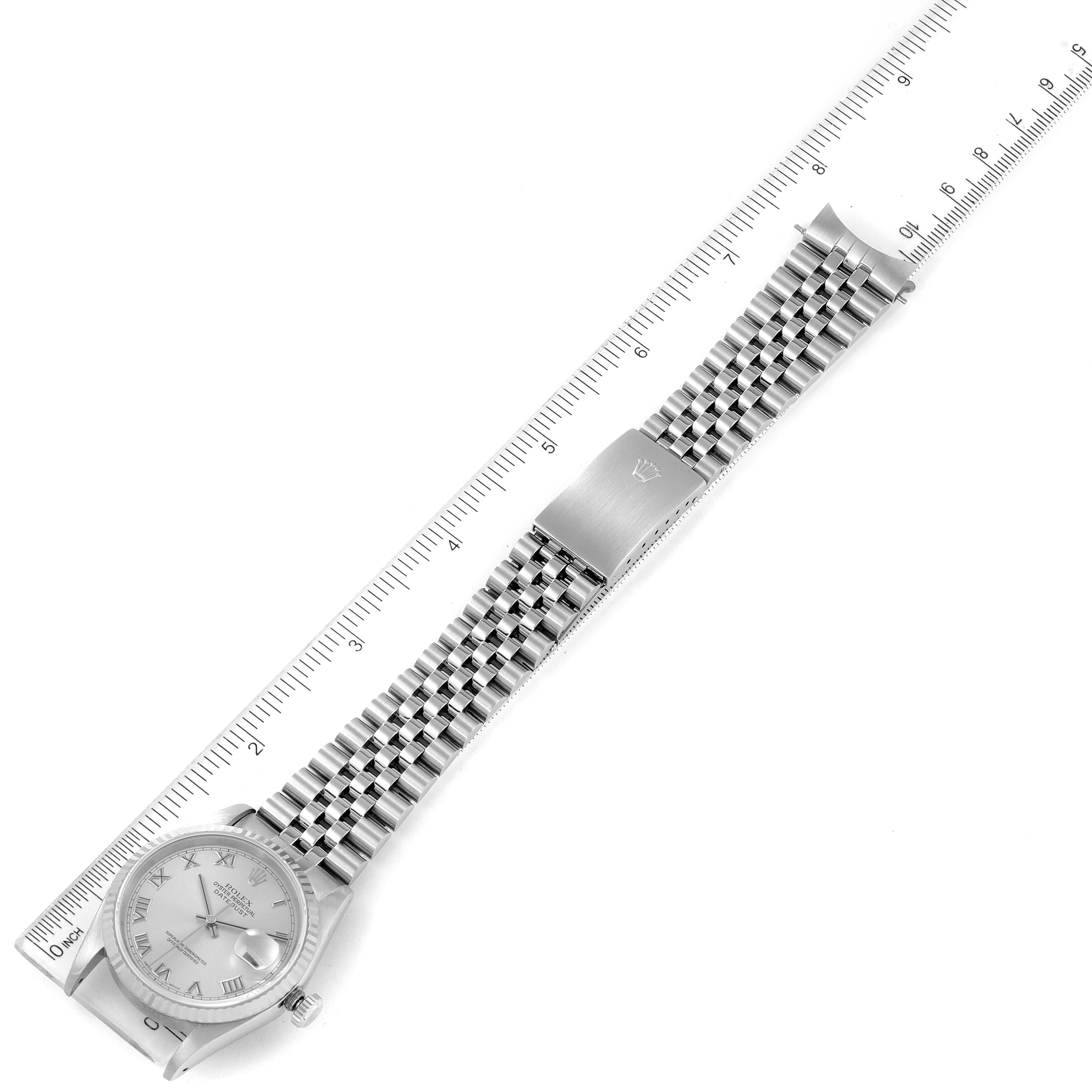 The image shows a Rolex Datejust 16234 Men's Stainless Steel Silver Dial 16234 Men's Stainless Steel Silver Dial watch laid flat with a ruler, displaying the face, bracelet, and clasp.