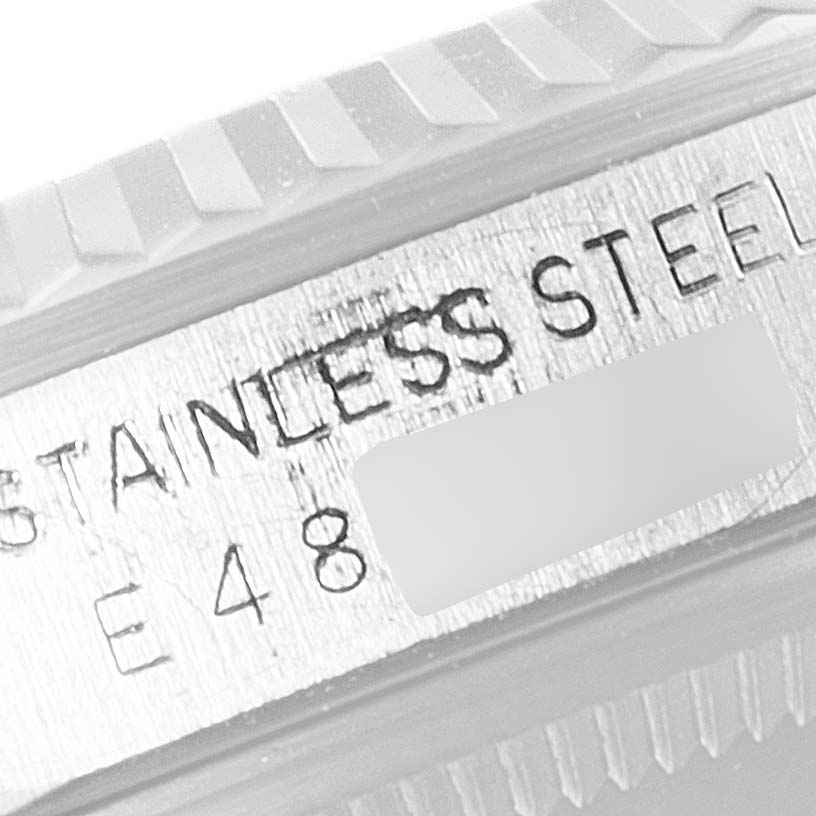 The image shows a close-up of the stainless steel case back of a Rolex Datejust 16234 Men's Stainless Steel Silver Dial 16234 Men's Stainless Steel Silver Dial watch with some engraved markings.