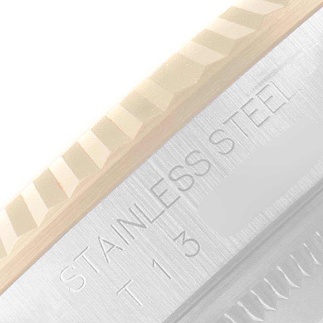 The image shows a close-up of the stainless steel portion and fluted bezel of a Rolex Datejust 16233 Men's Steel and Gold (two tone) Black Dial 16233 Men's Steel and Gold (two tone) Black Dial watch.