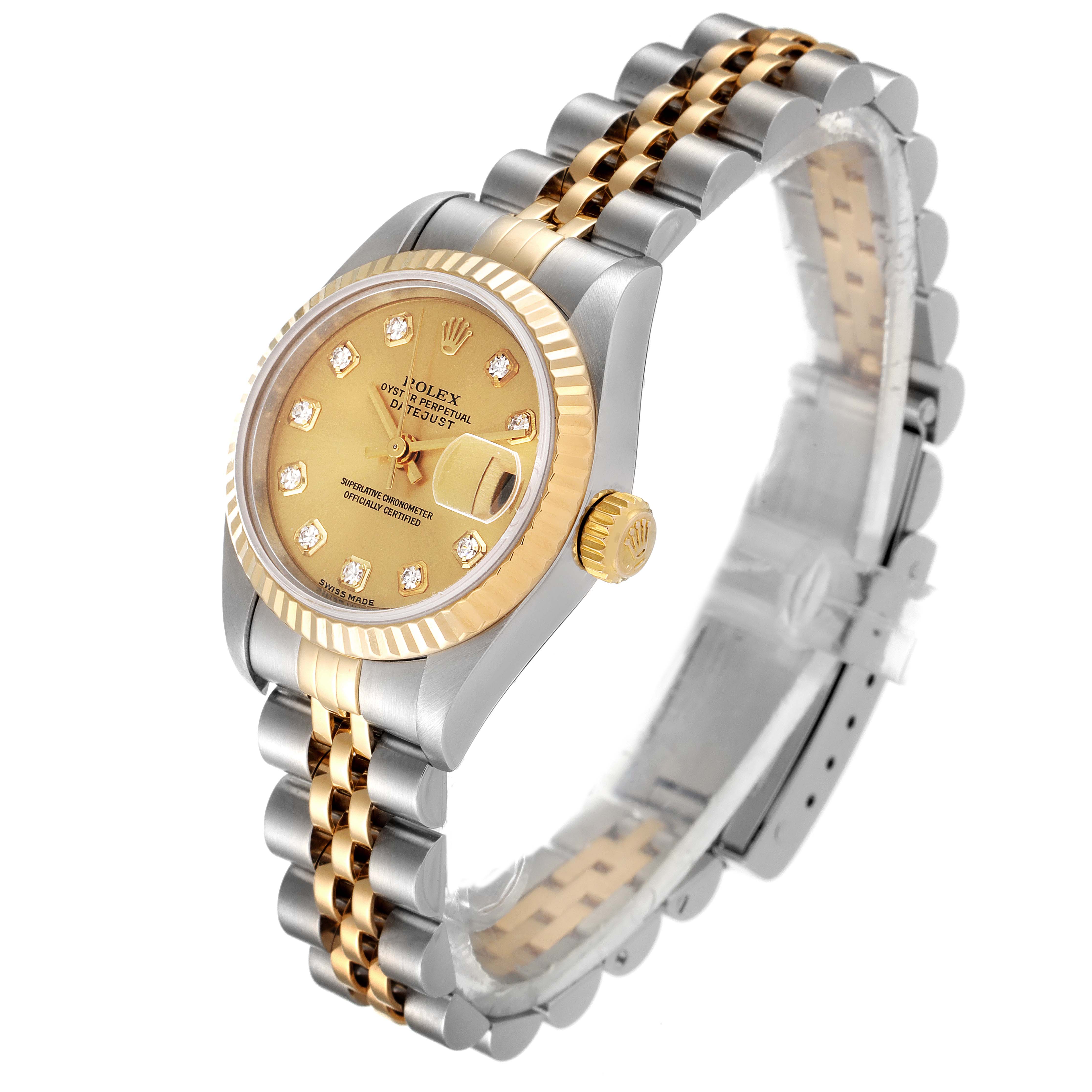 The image shows a Rolex Datejust 79173 Women
s Steel and Gold (two tone) Champagne Dial 79173 Women
s Steel and Gold (two tone) Champagne Dial watch at an angle, highlighting its gold dial, two-tone bezel, and bracelet.