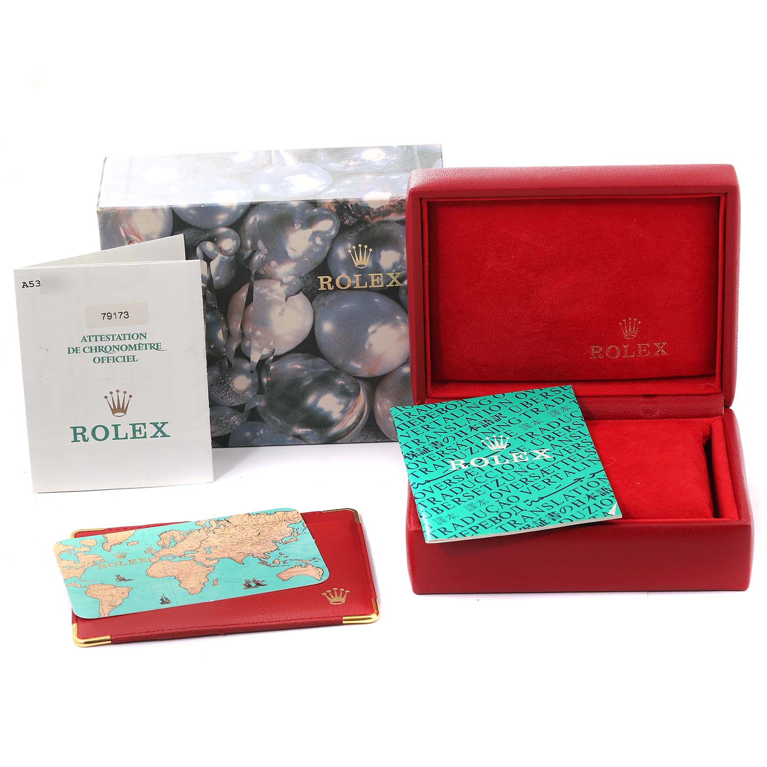 The image shows a Rolex Datejust 79173 Women's Steel and Gold (two tone) Champagne Dial 79173 Women's Steel and Gold (two tone) Champagne Dial set including an empty red watch box, documents, and outer packaging from a front angle.