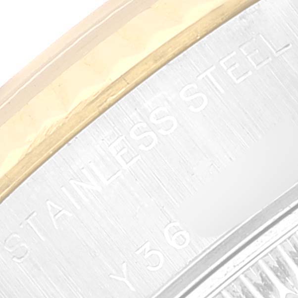 The image shows a close-up of the case back edge and part of the fluted bezel of the Rolex Datejust 79173 Women's Steel and Gold (two tone) Champagne Dial 79173 Women's Steel and Gold (two tone) Champagne Dial.