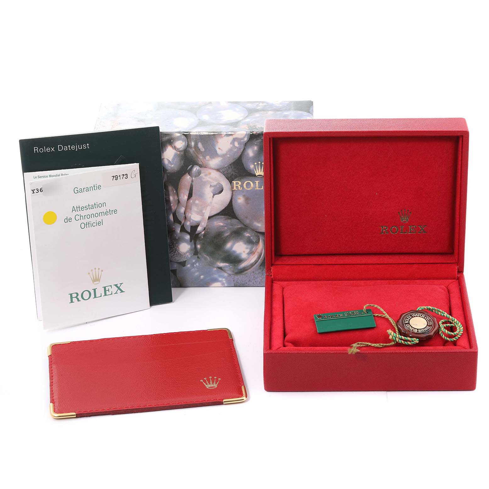 The image shows packaging, a warranty card, tags, a booklet, and a display box for a Rolex Datejust 79173 Women's Steel and Gold (two tone) Champagne Dial 79173 Women's Steel and Gold (two tone) Champagne Dial watch.