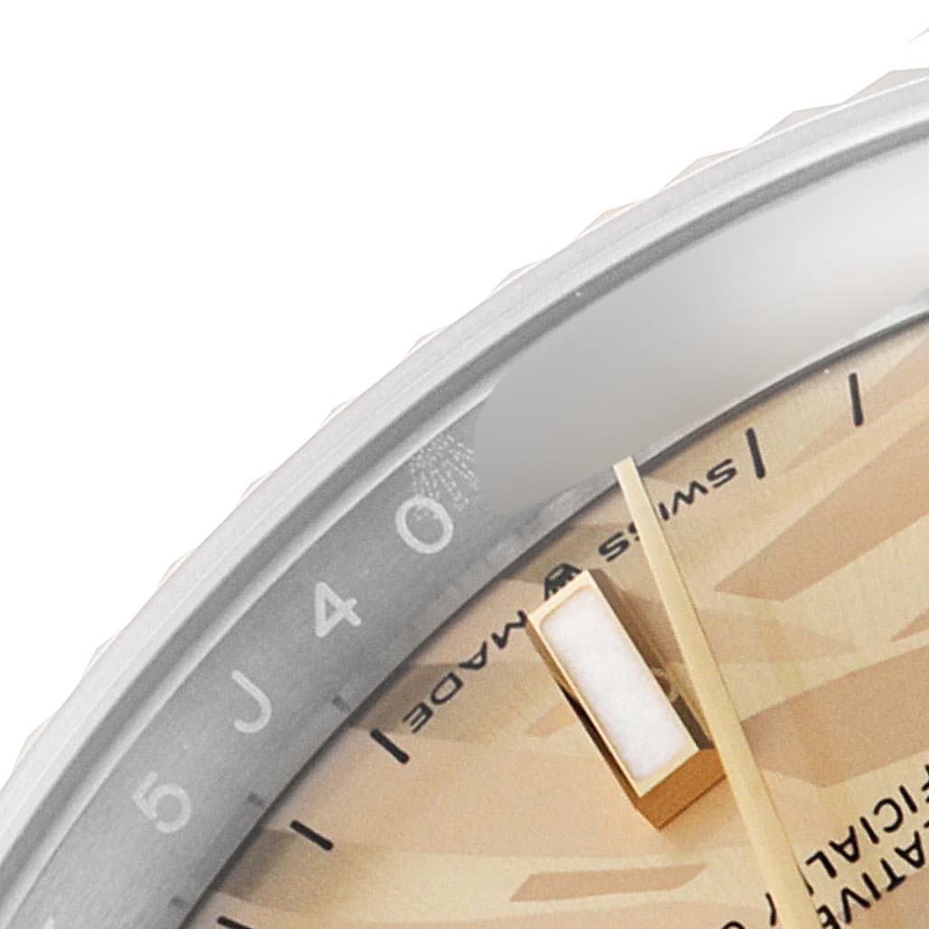 This close-up image shows the dial and part of the bezel of a Rolex Datejust 126233 Men's Steel and Gold (two tone) Champagne Dial 126233 Men's Steel and Gold (two tone) Champagne Dial watch, highlighting the "Swiss Made" text and hour markers.