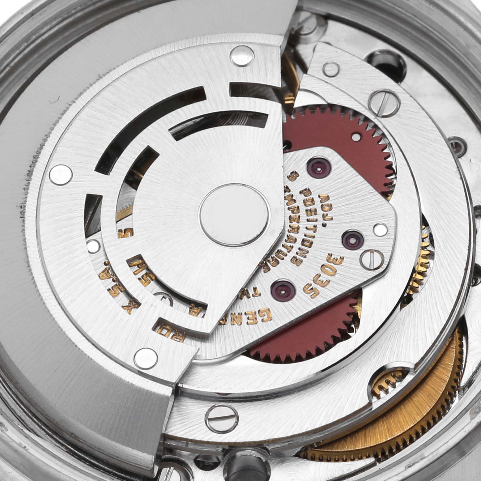 The image shows an inside view of the Rolex Datejust 16013 Men's Steel and Gold (two tone) Champagne Dial 16013 Men's Steel and Gold (two tone) Champagne Dial movement mechanism, highlighting gears and rotor.