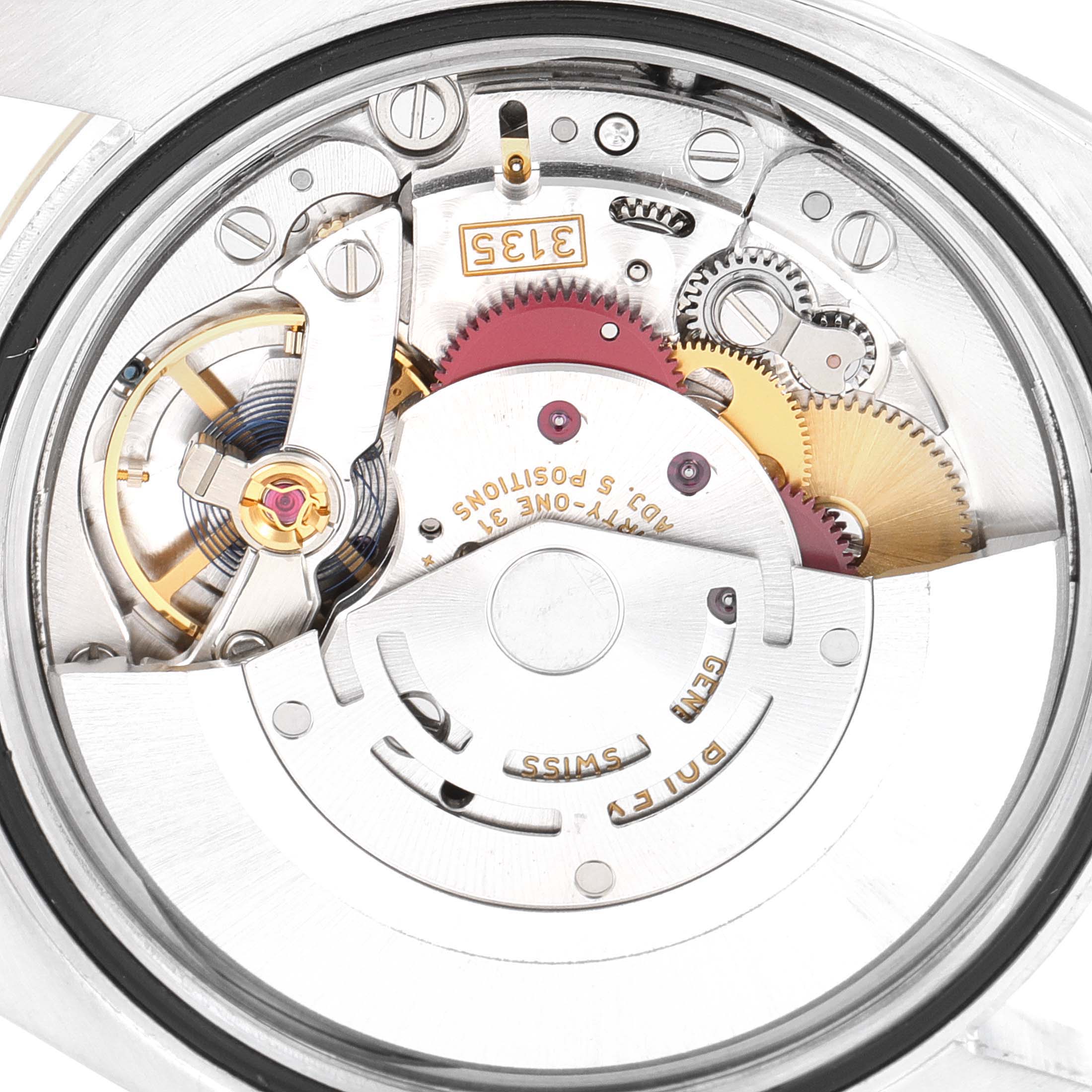 This is a close-up view of the inner mechanical movement of a Rolex Datejust 116233 Men's Steel and Gold (two tone) White Dial 116233 Men's Steel and Gold (two tone) White Dial watch.