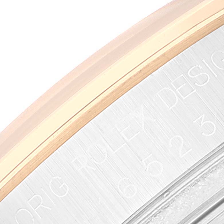 This image shows a close-up of the edge and engraving details on the bezel of a Rolex Daytona 16523 Men's Steel and Gold (two tone) White Dial 16523 Men's Steel and Gold (two tone) White Dial watch.