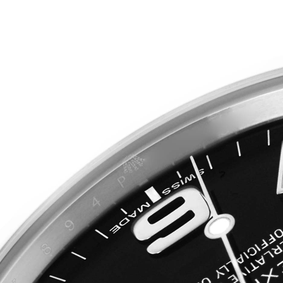 The image shows a close-up of the dial of a Rolex Explorer 214270 Men's Stainless Steel Black Dial 214270 Men's Stainless Steel Black Dial, highlighting the numeral "9," part of "Swiss Made," and the second hand.