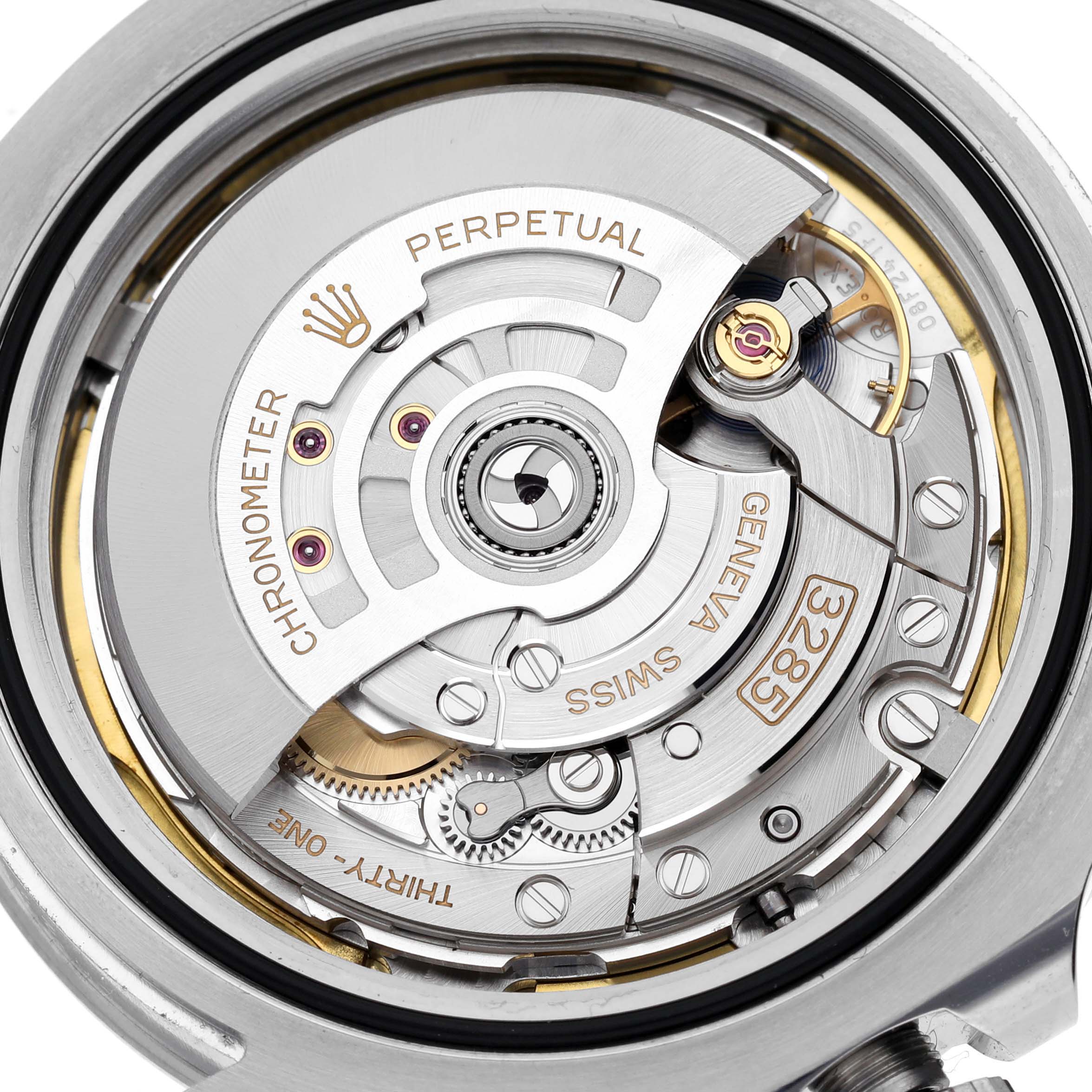 The image shows the movement of a Rolex Explorer M226570-0002 Men's Stainless Steel Black Dial M226570-0002 Men's Stainless Steel Black Dial watch, including the rotor and gears, viewed from the back.