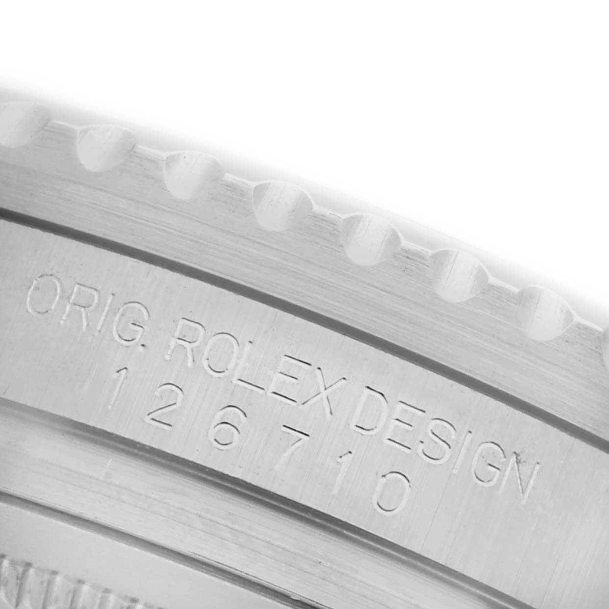 The image shows a close-up angle of the bezel edge with engravings on the Rolex GMT-Master 126710BLNR Men
s Stainless Steel Black Dial 126710BLNR Men
s Stainless Steel Black Dial, model number 126710.