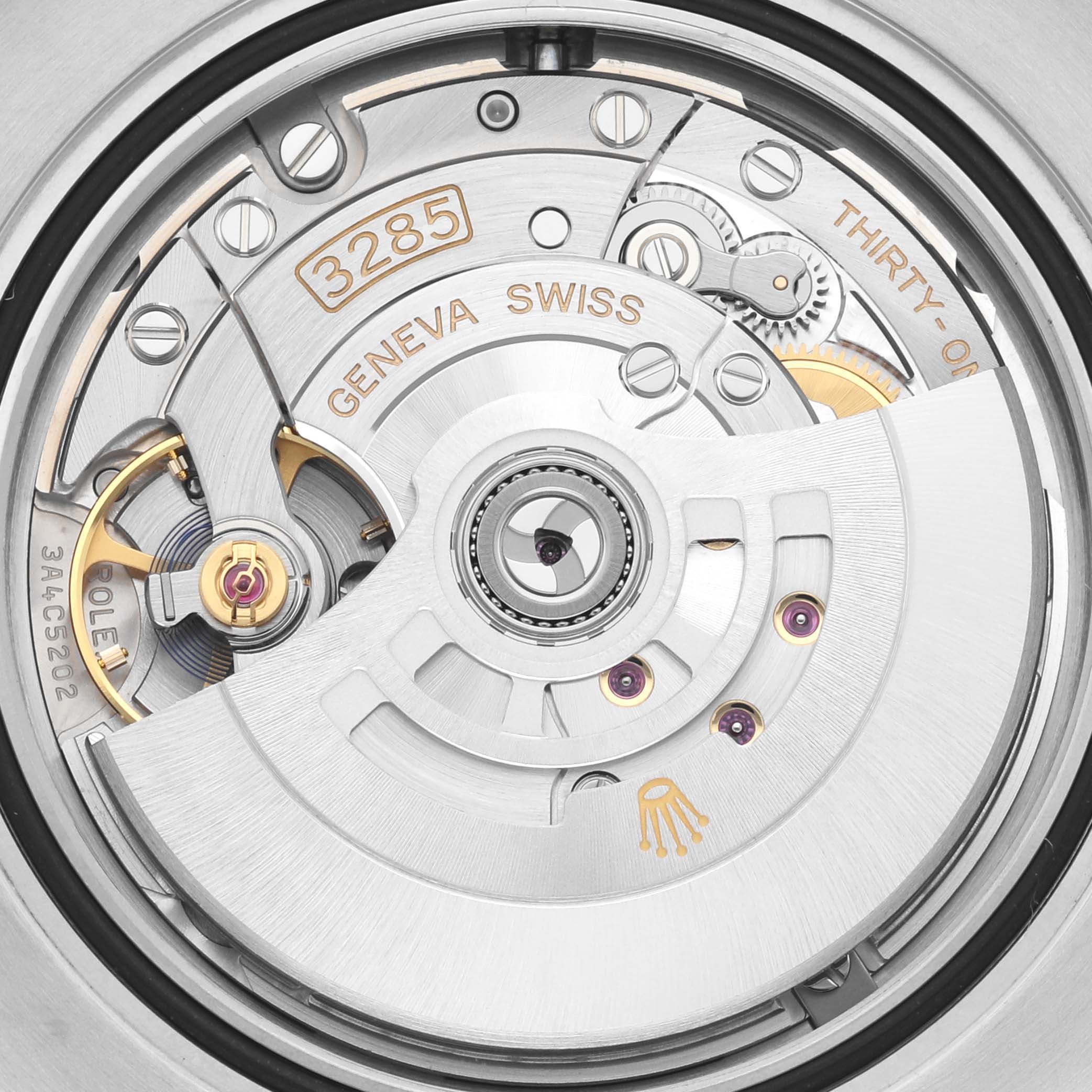 The image shows the intricate movement mechanism of the Rolex GMT-Master 126710BLNR Men's Stainless Steel Black Dial 126710BLNR Men's Stainless Steel Black Dial watch.