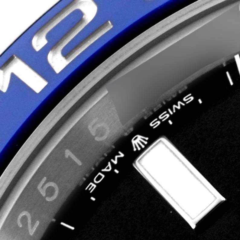 The image shows a close-up of the Rolex GMT-Master 126710BLNR Men's Stainless Steel Black Dial 126710BLNR Men's Stainless Steel Black Dial watch, highlighting the bezel, partial hour markers, and "SWISS MADE" text.