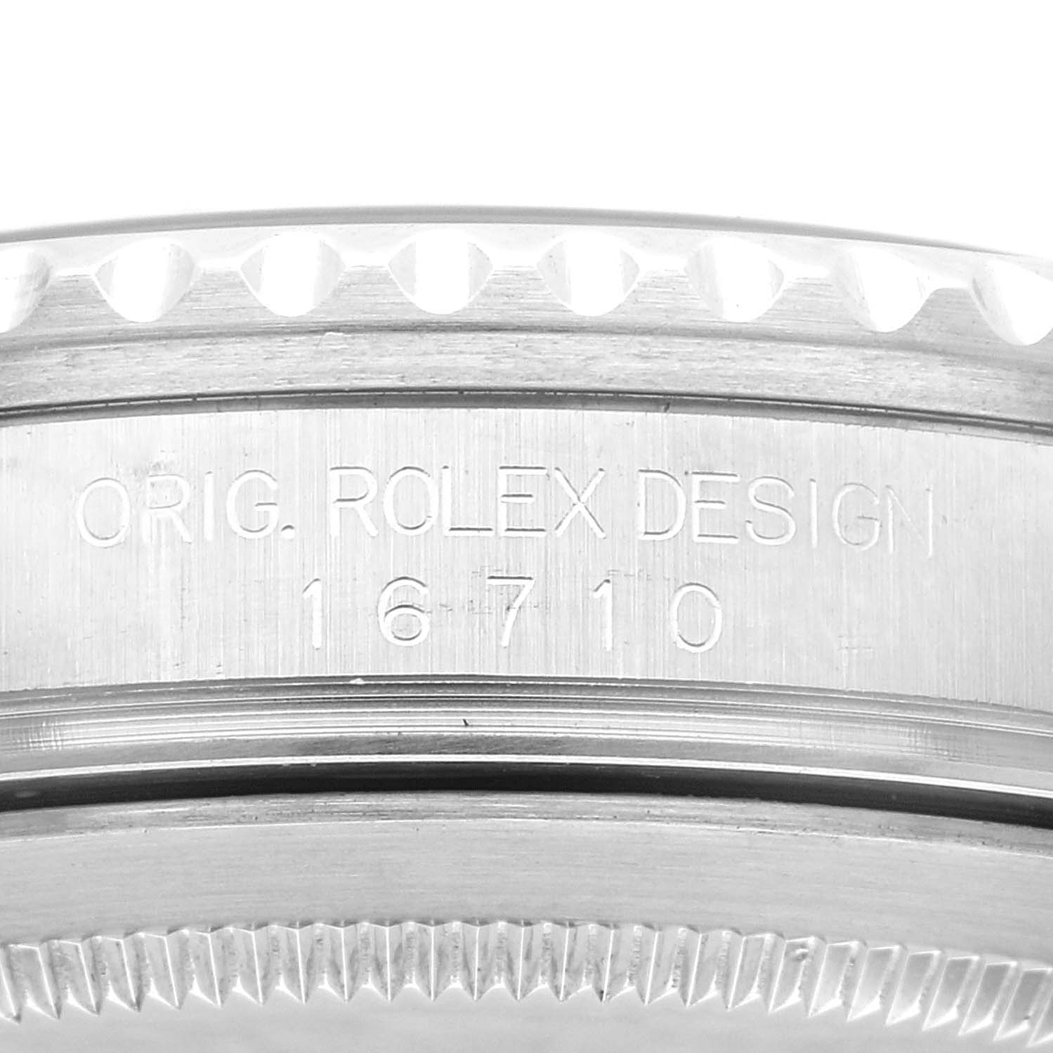 The image shows a close-up of the case side of a Rolex GMT-Master 16710 Men's Stainless Steel Black Dial 16710 Men's Stainless Steel Black Dial, revealing the model number 16710 and "ORIG. ROLEX DESIGN" engraving.