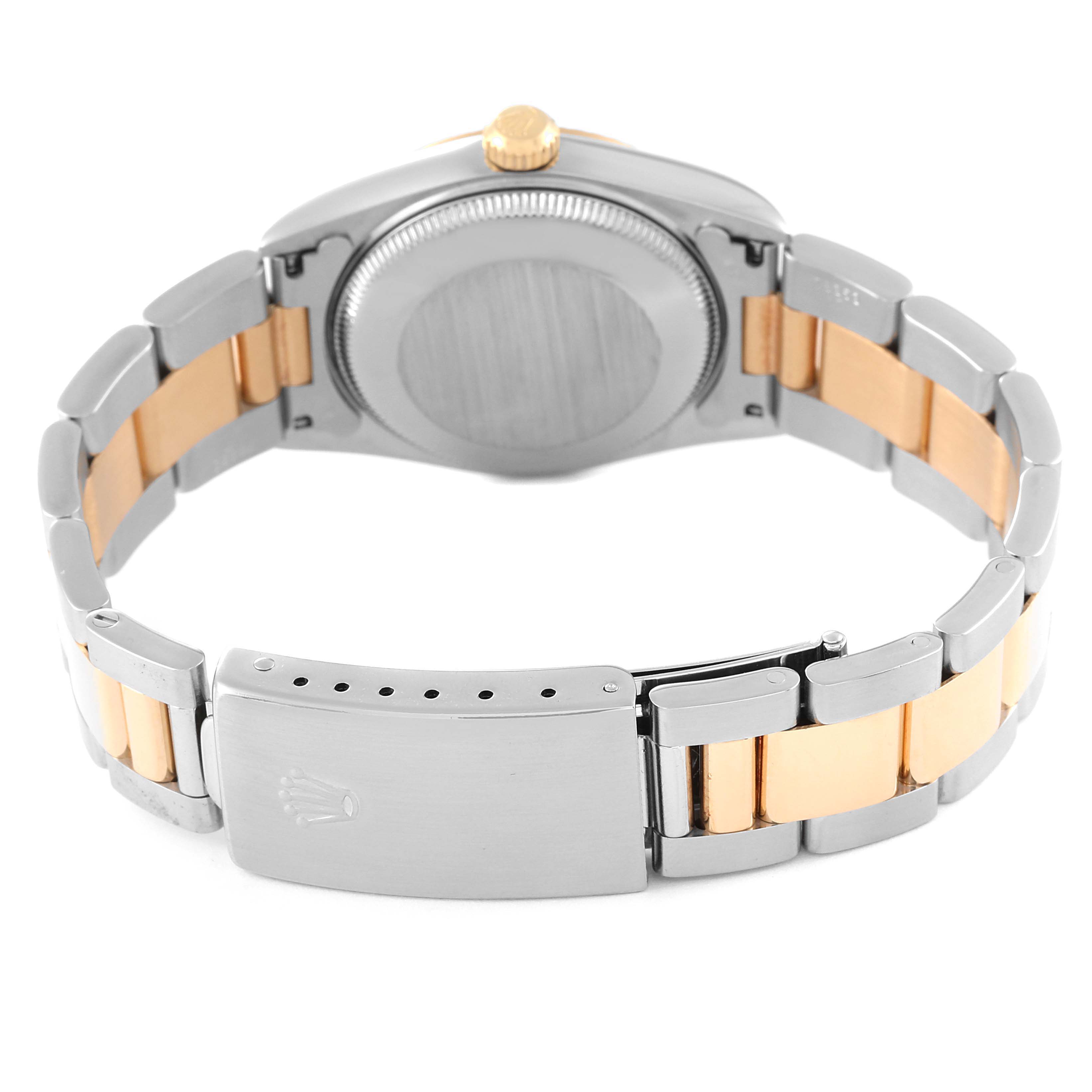 The image shows the back of a Rolex Mid-Size 77513 Women
s Steel and Gold (two tone) White Dial 77513 Women
s Steel and Gold (two tone) White Dial watch, focusing on the bracelet and clasp.