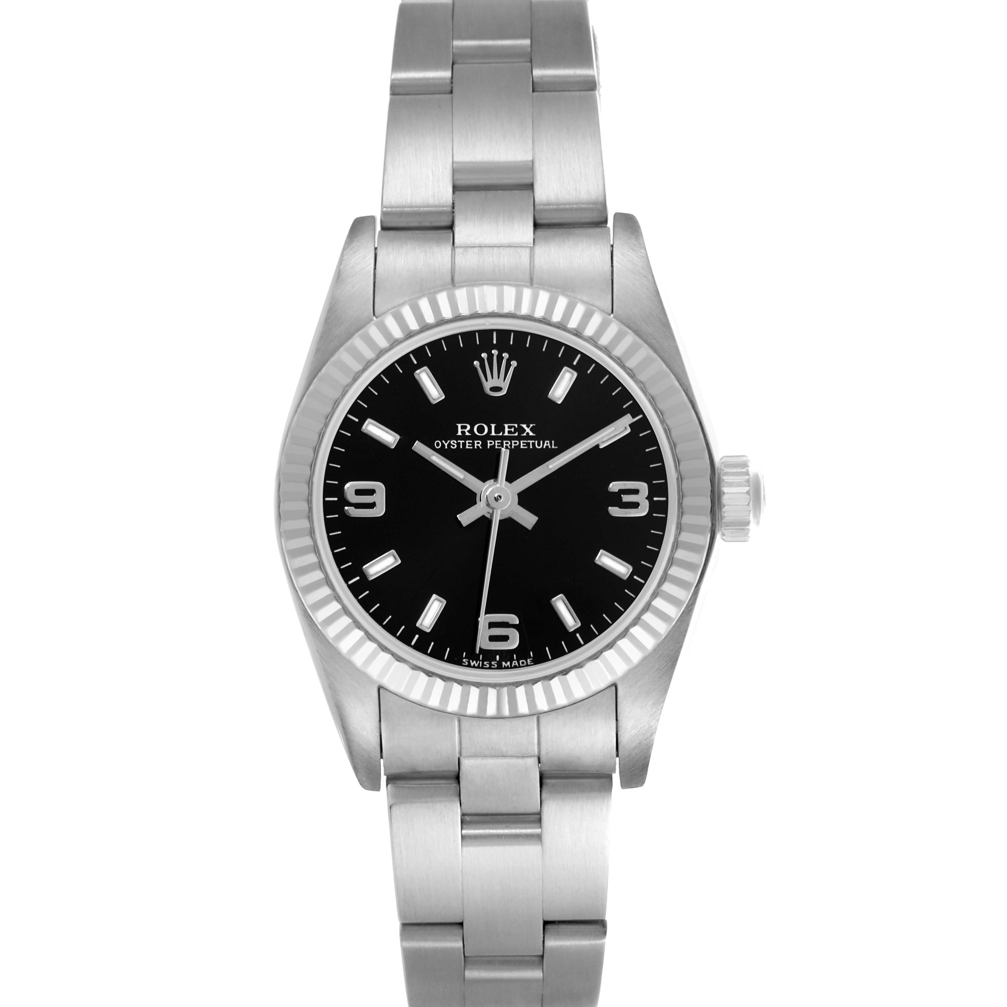 The Rolex Oyster Perpetual 76094 Women's Stainless Steel Black Dial 76094 Women's Stainless Steel Black Dial watch is shown from a front angle, highlighting its dial, bezel, and bracelet.