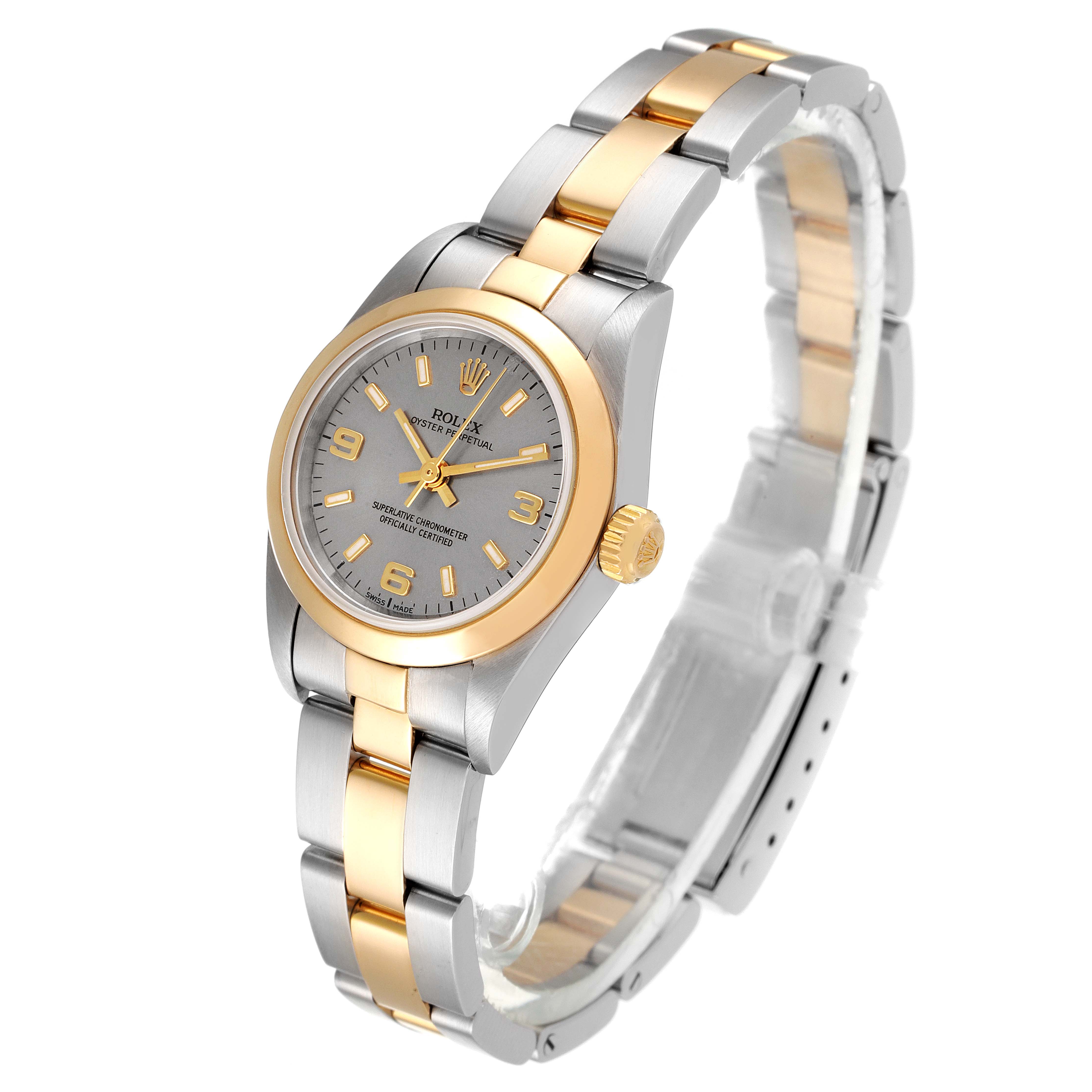 The Rolex Oyster Perpetual 76183 Women's Steel and Gold (two tone) Grey Dial 76183 Women's Steel and Gold (two tone) Grey Dial watch is shown at an angle displaying the face, bezel, and bracelet in gold and silver tones.