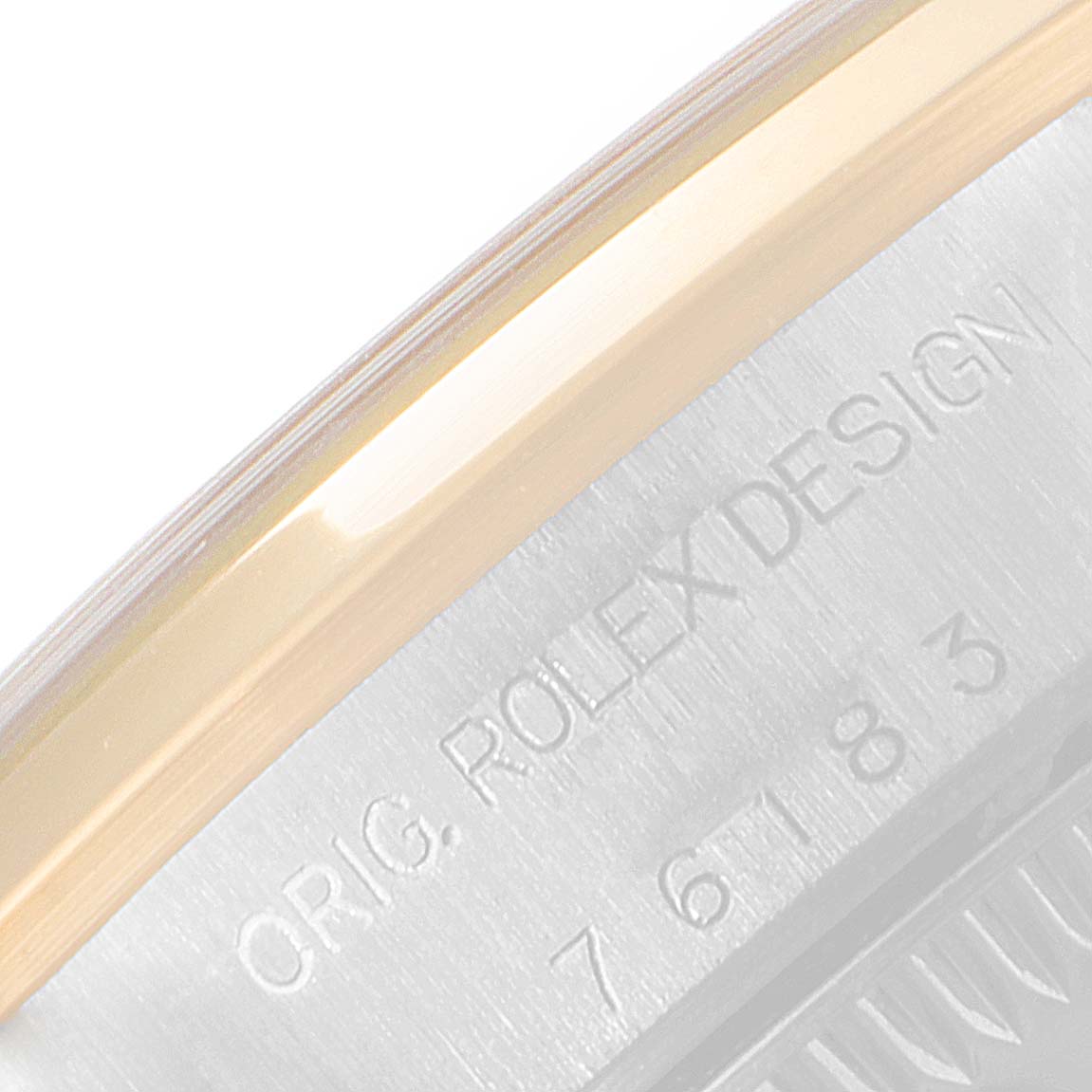This is a close-up shot of the side engraving on a Rolex Oyster Perpetual 76183 Women's Steel and Gold (two tone) Grey Dial 76183 Women's Steel and Gold (two tone) Grey Dial watch.