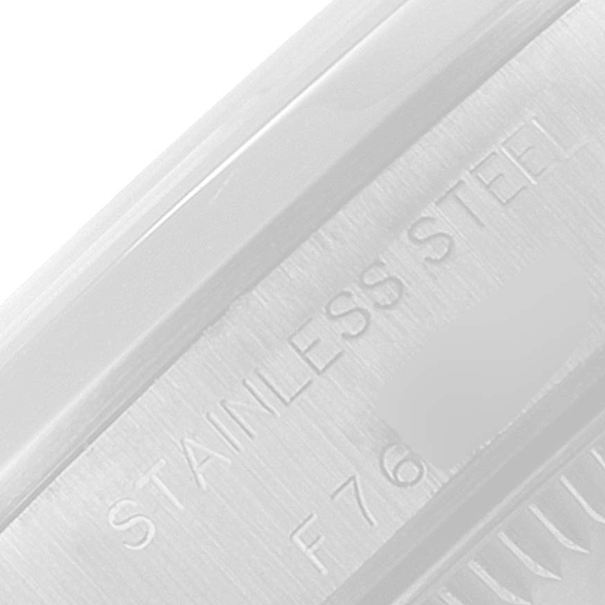 The image shows a close-up view of the side engraving on a stainless steel Rolex Oyster Perpetual 76080 Women
s Stainless Steel Pink Dial 76080 Women
s Stainless Steel Pink Dial watch.