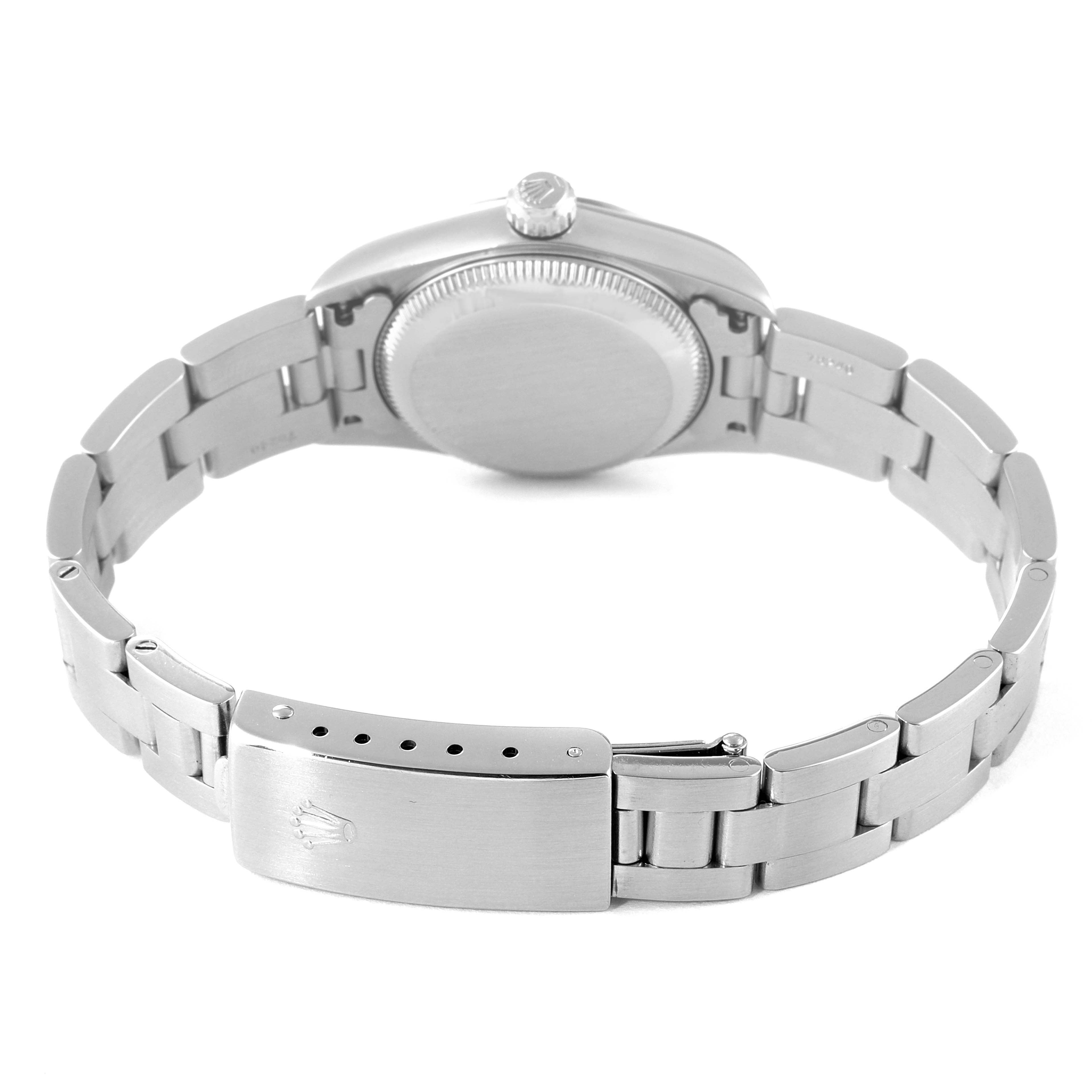 The image shows the backside and strap of a Rolex Oyster Perpetual 76080 Women
s Stainless Steel Pink Dial 76080 Women
s Stainless Steel Pink Dial watch, featuring its closed case back and bracelet with a clasp.