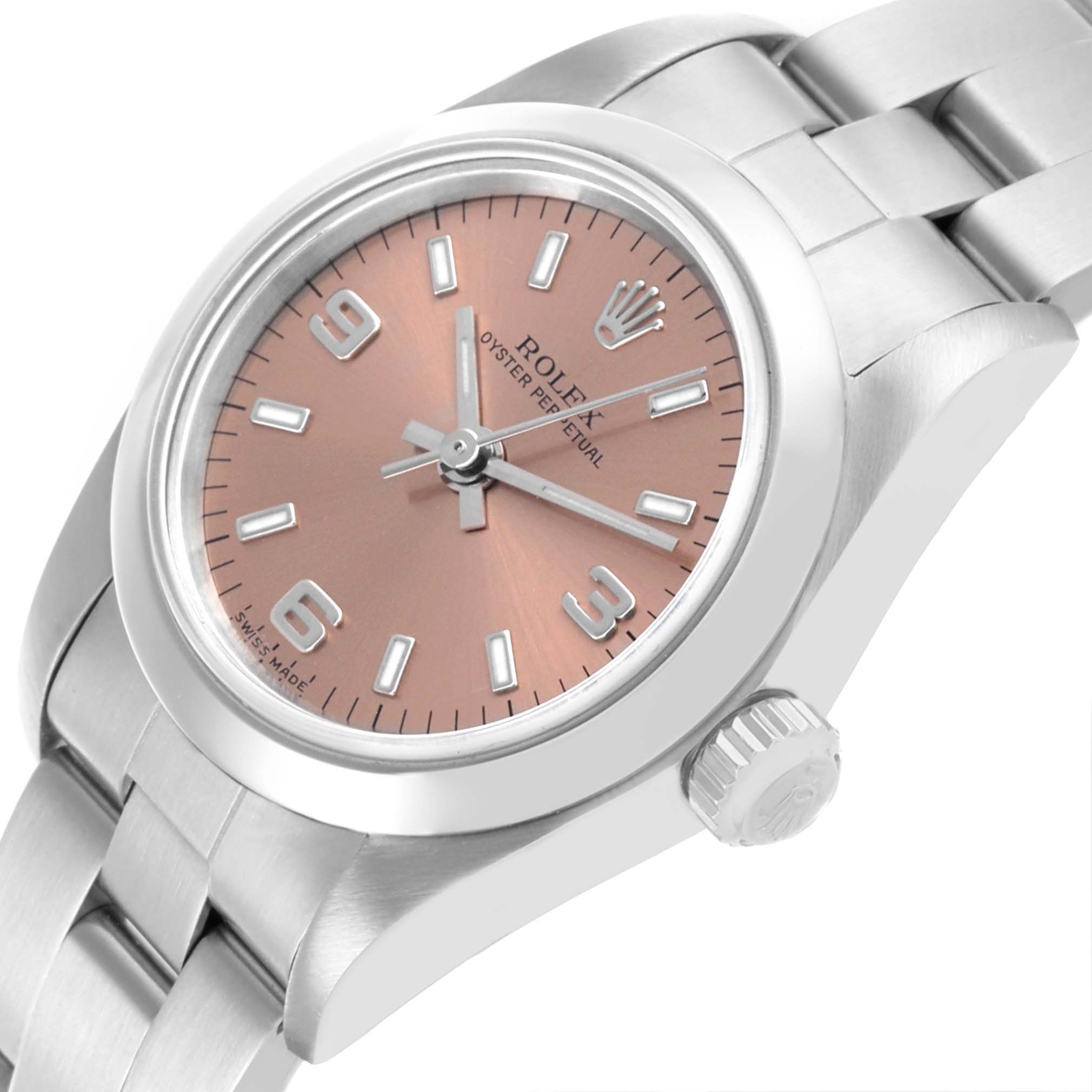 The Rolex Oyster Perpetual 76080 Women's Stainless Steel Pink Dial 76080 Women's Stainless Steel Pink Dial watch is shown at a slight angle, highlighting the dial, bezel, bracelet, and crown.