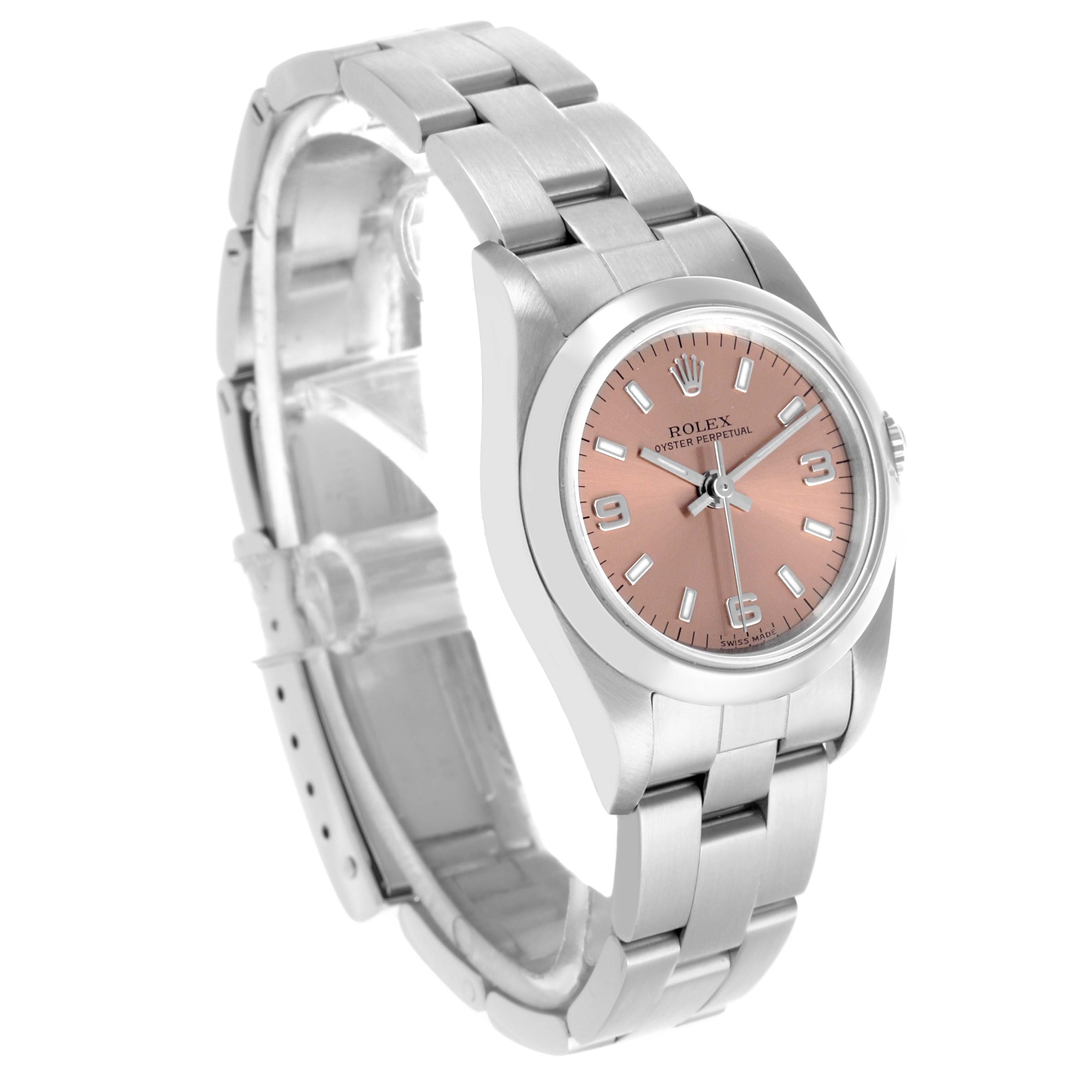 The Rolex Oyster Perpetual 76080 Women's Stainless Steel Pink Dial 76080 Women's Stainless Steel Pink Dial watch is shown at an angled side view, highlighting the bracelet, case, and face with a pink dial.