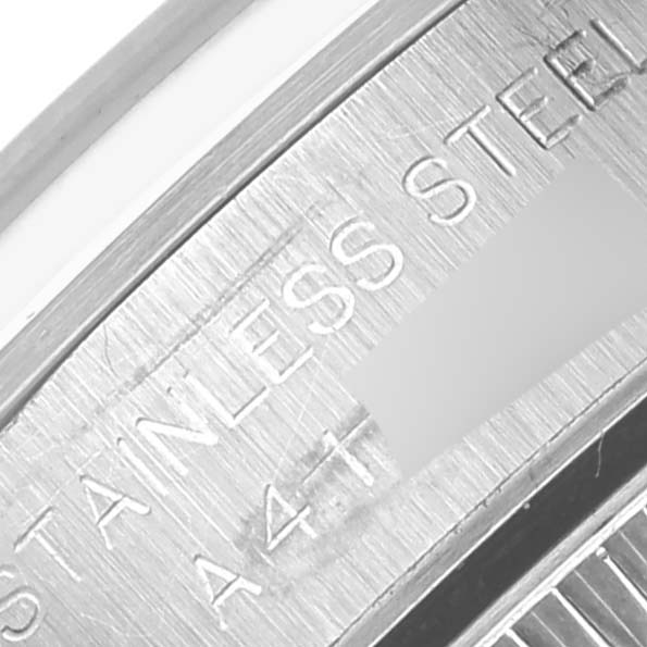 The image shows a close-up angle of the inner part of the stainless steel case back of a Rolex Oyster Perpetual 76080 Women's Stainless Steel Pink Dial 76080 Women's Stainless Steel Pink Dial watch.