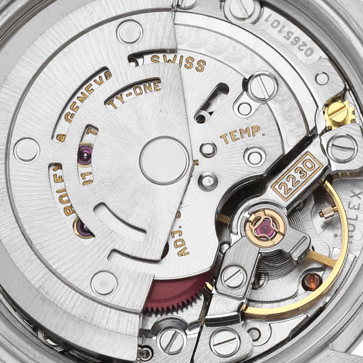 The image shows the internal movement of a Rolex Oyster Perpetual 76080 Women's Stainless Steel Pink Dial 76080 Women's Stainless Steel Pink Dial, displaying gears and intricate mechanics from a top-down angle.