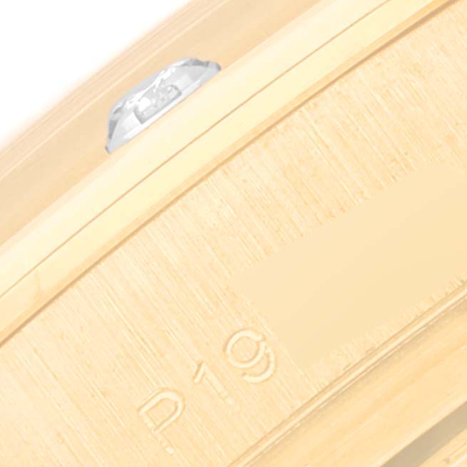 The image shows a close-up of the edge and markings on the bracelet of a Rolex Pearlmaster 80318 Women's Yellow Gold Champagne Dial 80318 Women's Yellow Gold Champagne Dial watch.